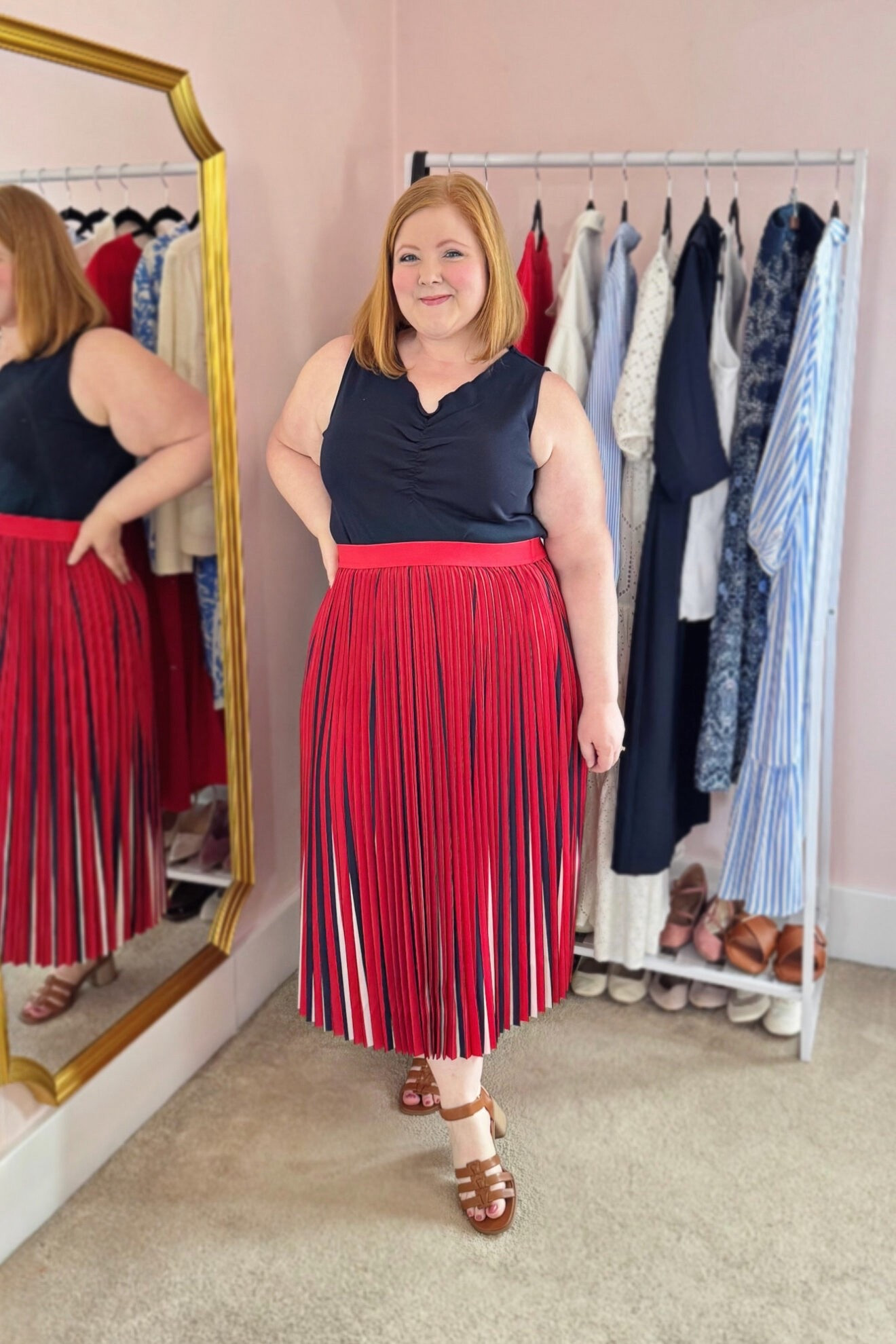 Tank and Pleated Midi Skirt Outfit

I’m wearing this Ribbed Curly Hem Tank (sizes 12/14-32/34; $39.95) and Pleated Color Pop Elastic Waist A-Line Skirt (sizes 12/14-32/34; $89.95), both in the size 16/18. This is the navy version of the white tank above, and you can see more of the curly hem around the neckline on this one. Again, this tank is a great wardrobe staple. The cotton fabric and curly hem do make it more casual though.

I’m wearing this skirt in the size 16/18, and the waistband runs a little loose and is also super stretchy. You could potentially size down in this one if you like since the waist is so stretchy. The red, white, and blue colors are perfect for summer Americana season. I’d wear this to the office or on the weekends with a white denim jacket and sneakers. Use code WWWULLA to shop this top + skirt combo for $85.

#LTKPlusSize #LTKootd #LTKMidsize