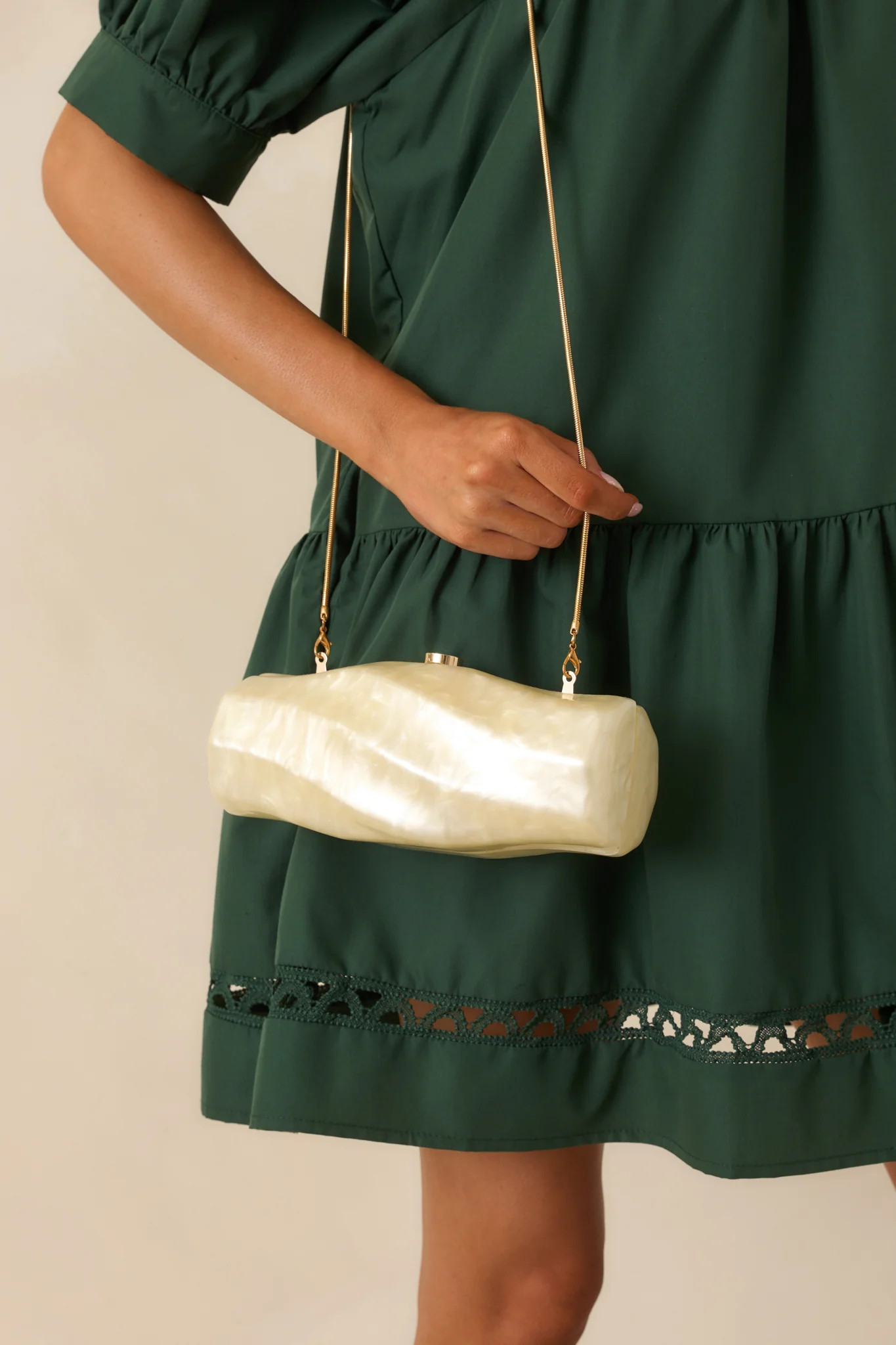 Got My Spark Back Champagne Pearlescent Spiral Clutch | Red Dress