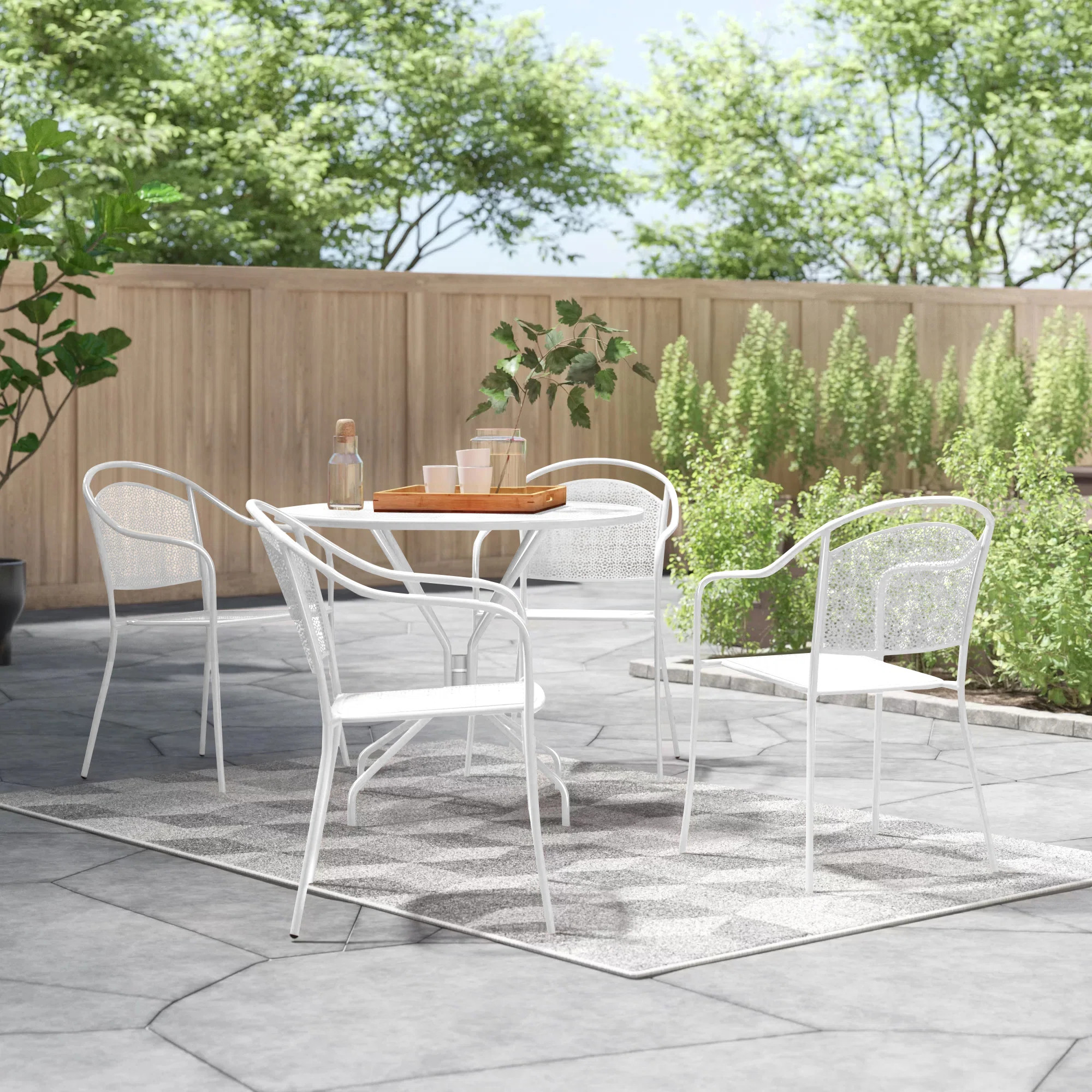 Chanea 35.25'' Round Indoor-Outdoor Steel Patio Table Set with 4 Round Back Chairs | Wayfair North America