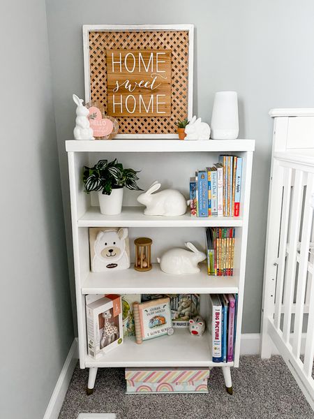 Nursery bookcase decorations. Love the Hatch night light, this baby activity book, and this giraffe tether. 

#LTKbaby #LTKfamily #LTKunder50