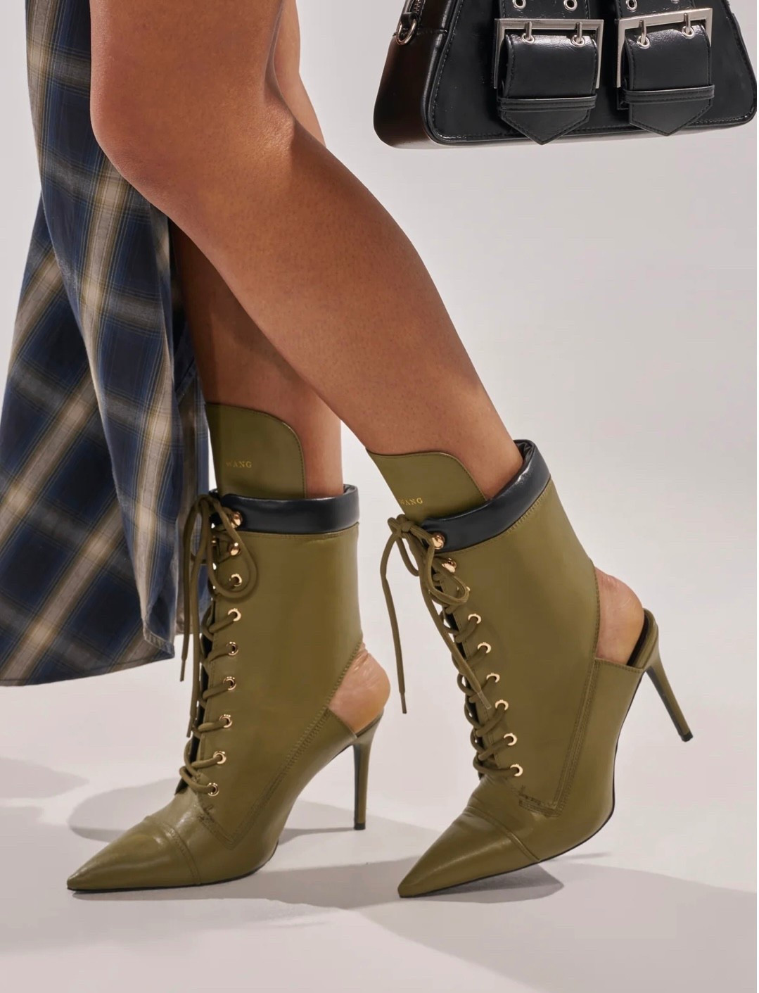 Olive green lace up boots with pointed toe and sleek stiletto heel. Chic, edgy, and perfect for day-to-night styling. 

#LTKSaleAlert #LTKootd #LTKgrwm