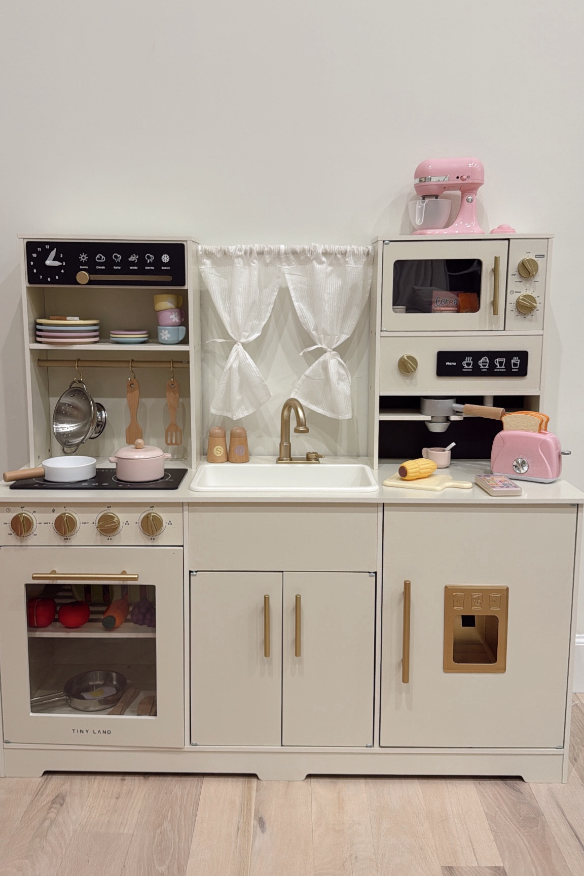 we have the new version of the play kitchen that you can only get on Tiny Land website! It has the white curtains vs yellow and the sink is working :)

kids play kitchen 

#LTKBaby #LTKKids