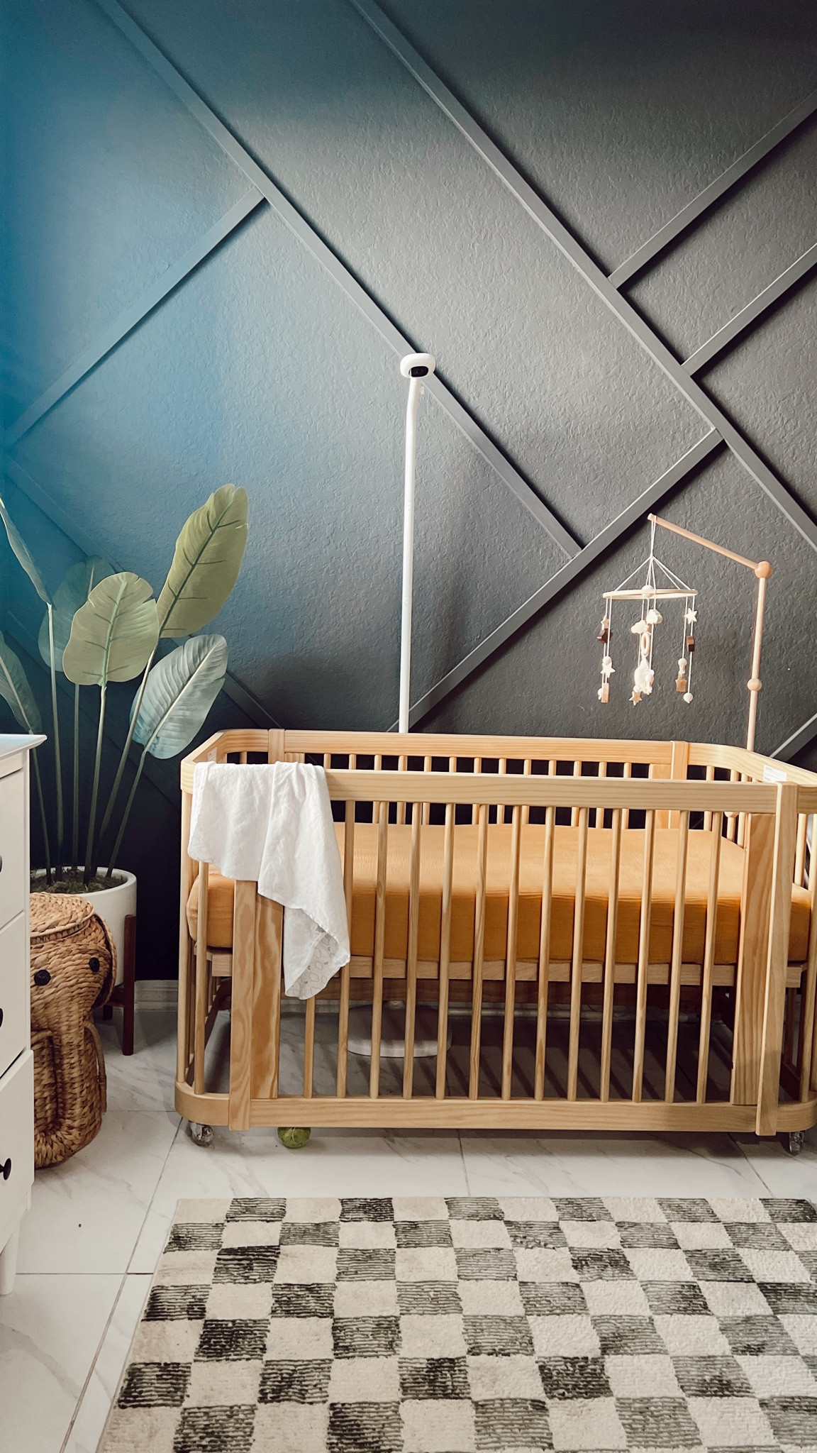 Nursery details - boy nursery! 

Crib is not likable on LTK but it's the Nestig Wave crib in Natural. 

We did the accent wall ourselves with wood from Home Depot. paint color is Sherman Williams Iron Ore.

Plant was from TJ Maxx years ago. 

We LOVE our nanit pro baby camera paired with the nanit sleepwear pajamas to track his breathing during naps 🩵

Everything else is linked below 🫶🏼

#LTKfamily #LTKbump #LTKbaby