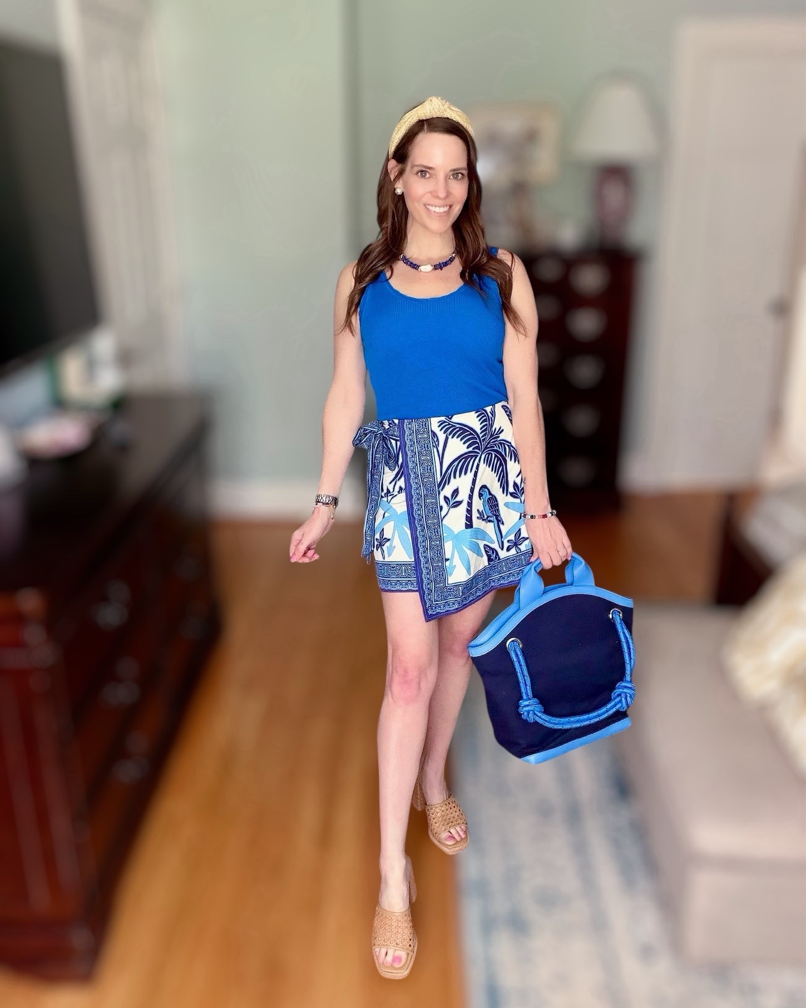 Blue & White Resort Wear Look 🌴💙 Spring Break Date Night Outfit

The ultimate blue & white moment for resort wear and spring break 💙🌴 This look is giving coastal chic with a fitted ribbed tank paired with a tropical print wrap mini skirt for that effortless vacation vibe. I styled it with raffia platform sandals, a woven knot headband, layered beaded jewelry, and a navy tote for the perfect polished finish.

This would be so cute for a beach vacation dinner, date night by the water, spring break outfits, or a coastal girls’ trip. The wrap skirt is lightweight and flattering, and the bold cobalt tank adds the prettiest pop of color against the palm print 🌊✨

Everything is linked for easy shopping!

Resort wear outfit, spring break outfit ideas, tropical vacation outfit, blue and white outfit, coastal chic style, beach dinner outfit, date night look, wrap mini skirt outfit, raffia sandals, woven headband, preppy spring style, vacation ready looks, beach bag, tote bag, swim coverup

#LTKootd #LTKOver40 #LTKSwim

#LTKSeasonal #LTKPetite #LTKOver40