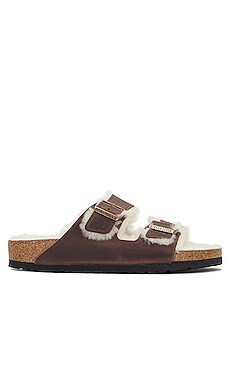 BIRKENSTOCK Arizona Shearling in Habana & Natural from Revolve.com | Revolve Clothing (Global)