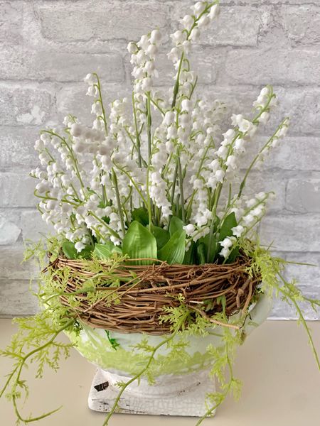 Make this beautiful faux lily of the valley centerpiece featuring this ceramic green and white compote from Wayfair. 

#LTKhome #LTKstyletip #LTKSeasonal