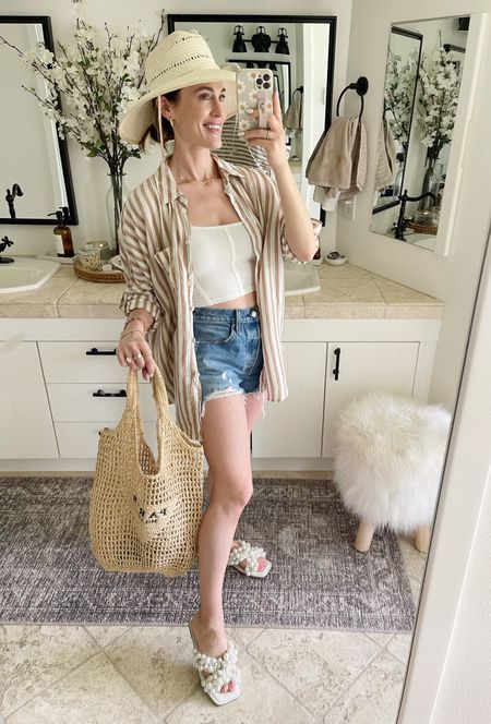 FASHION \ summer basics! Denim cutoff shorts (size up!), corset tank, oversized blouse, pearl slides, straw hat and a crochet tote bag (Amazon find!)☀️

Mom fit
Outfit 
Vacation 

#LTKSeasonal #LTKunder50 #LTKstyletip