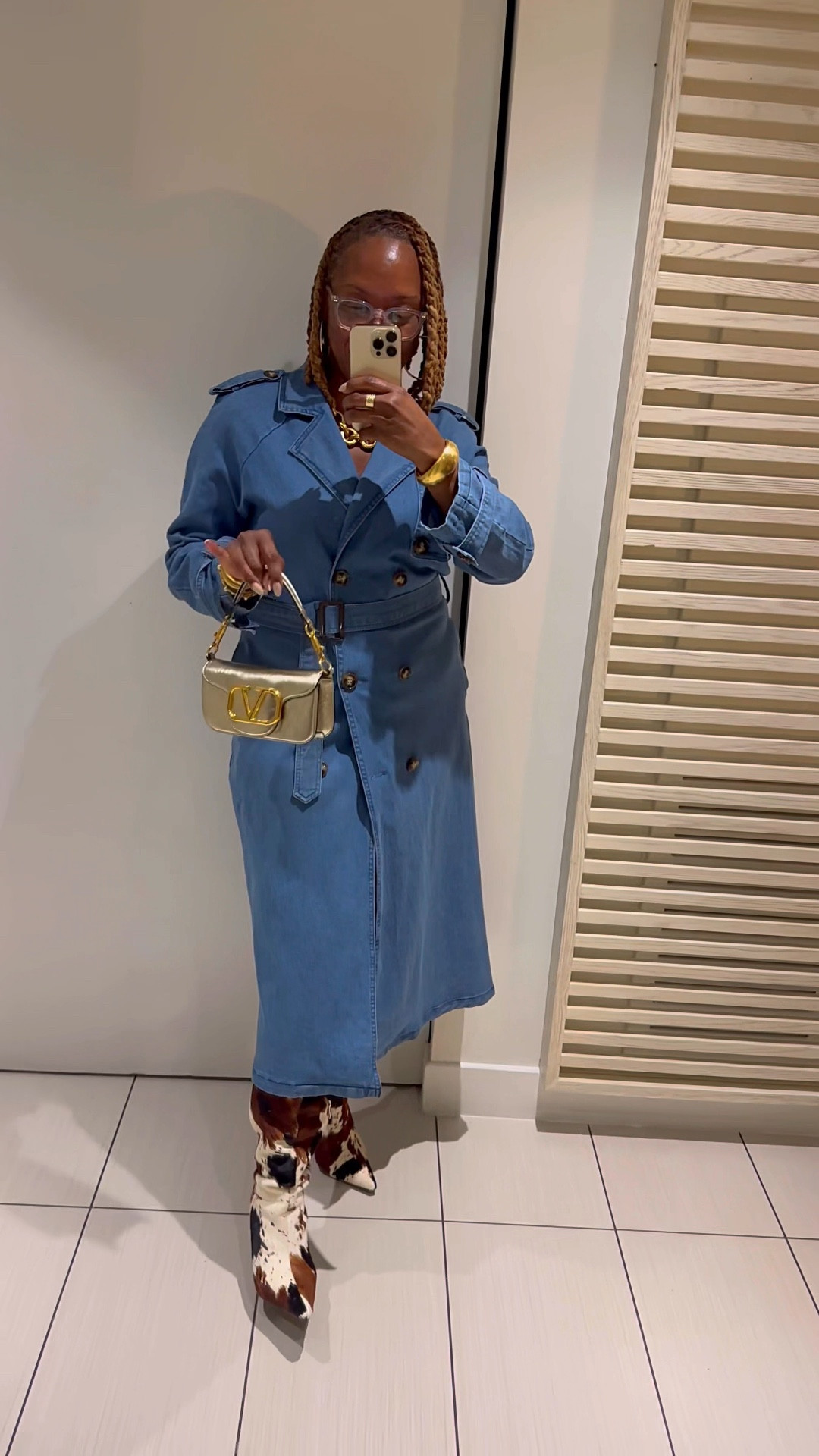 Wearing the denim tench coat as a dress on vacation with cow print boots from Akira 

#LTKdayinmylife #LTKTravel #LTKOver40