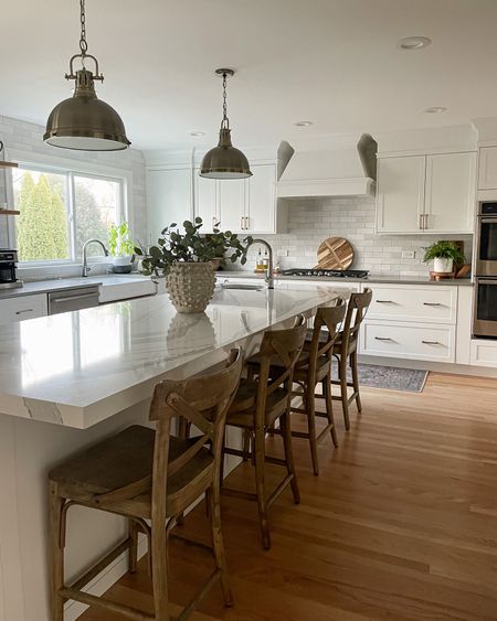 Kitchen design. IKEA kitchen. White kitchen. White kitchen cabinets. Home decor. Home design. Transitional style. Counter stools. Barstools. Island pendants. Vase. Faux eucalyptus leaves. Wood cutting board. Charcuterie board. Kitchen faucet. Subway tile.

#LTKhome #LTKFind