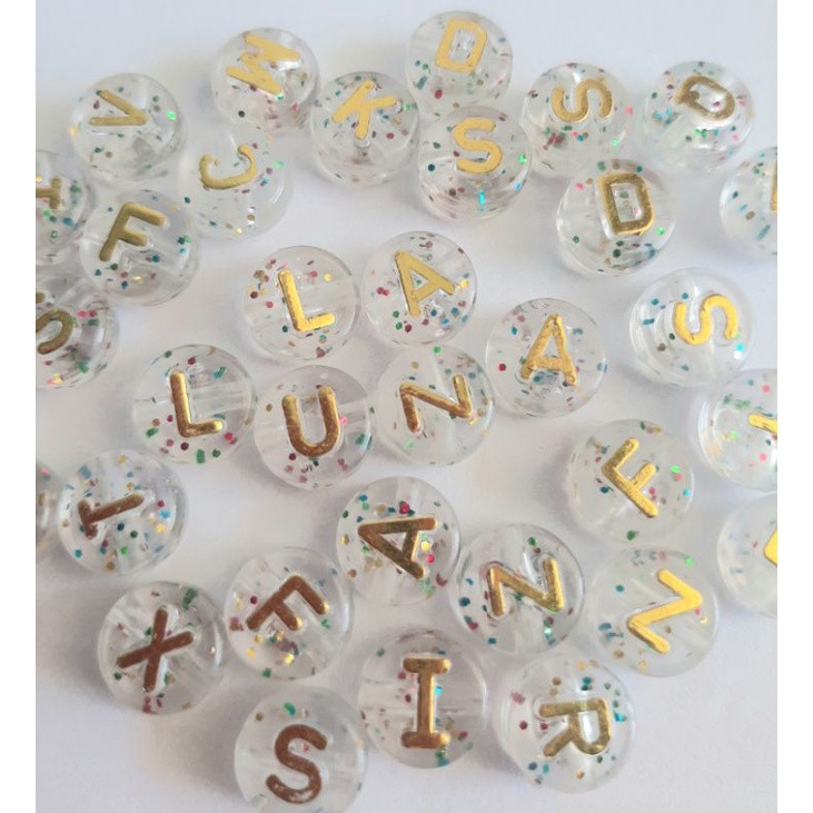 Miçanga Redonda translúcida com gliter e letra em dourado 10mm - 75 unidades | Shopee (BR)