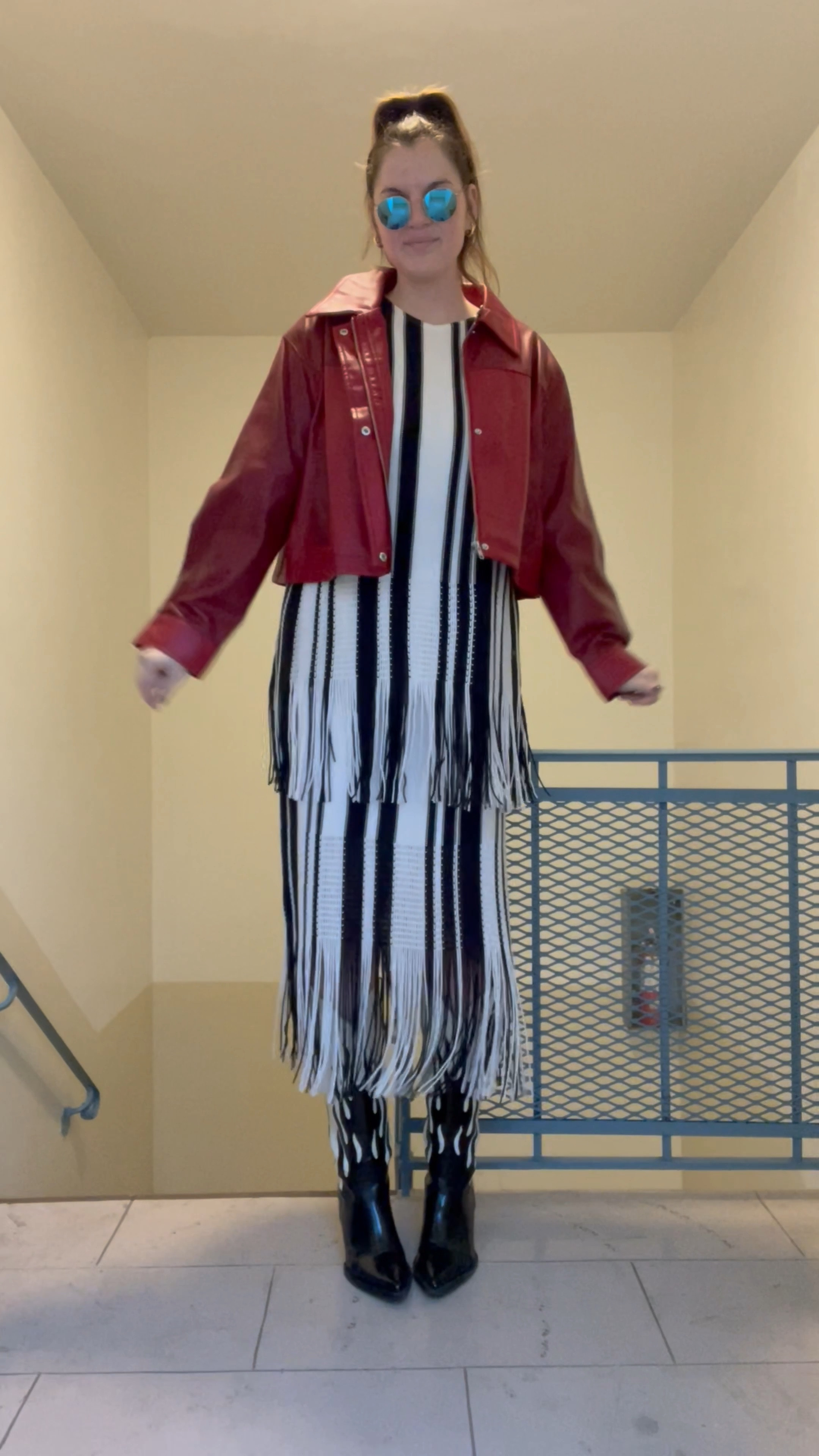 H&M Oversized Top with Fringe Hem, black and white stripes, matching set, budget friendly, fall/winter, affordable, Fringe-trimmed Skirt, red leather jacket from asos, black and white flame cowboy boots, blue rayban round flash sunglasses, pleasing harry styles canvas tote 

#LTKunder100 #LTKunder50 #LTKstyletip