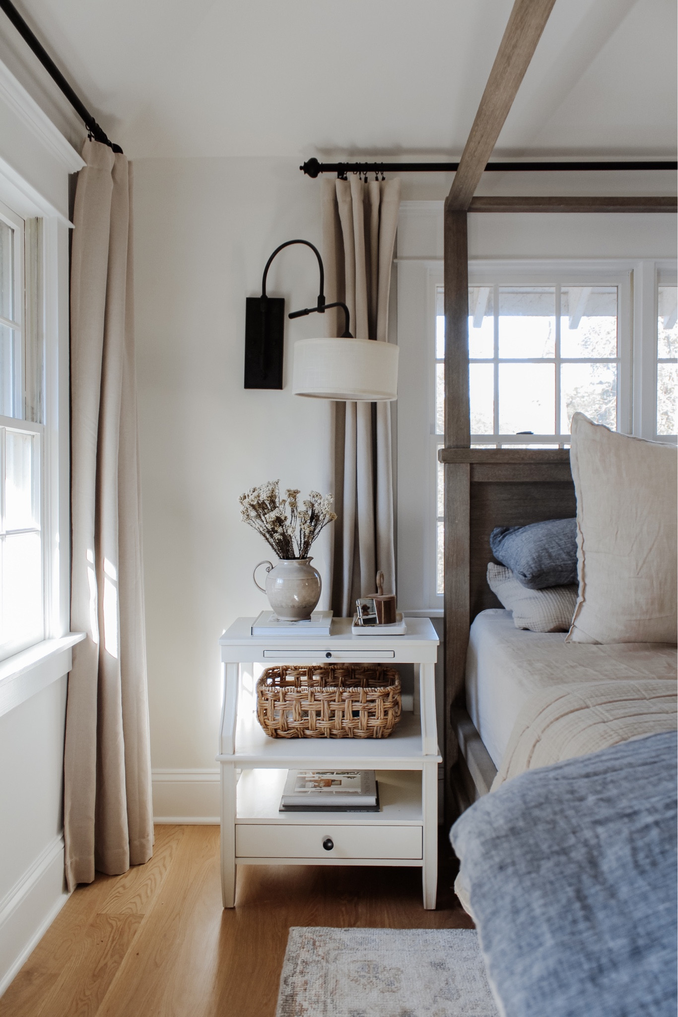 Forever inspired by natural light ✨ On the blog, this week’s affordable new arrivals range in accents + furniture to make a space that inspires you! Head to the link in bio to shop the items, my bedroom and much more.
•
•
•

4 poster wood bed, natural tone wood bed, canopy bed, linen duvet, stripe euro shams, floral decorative pillow, bed pillows, pillow inserts, cotton gauze quilts, layered bedding, nightstand decor, white two shelf nightstand, affordable furniture, quick ship furniture, swing light, nightstand wall light, affordable curtain, neutral bedroom, bedroom decor, black curtain rod, vintage decor, Target home, woven basket, lumbar pillow, floral throw pillow cover, blue bedding  Vintage look, patterned rug, muted rug, bedroom rug, light blue rug, neutral rug 

#LTKhome #LTKunder50 #LTKsalealert