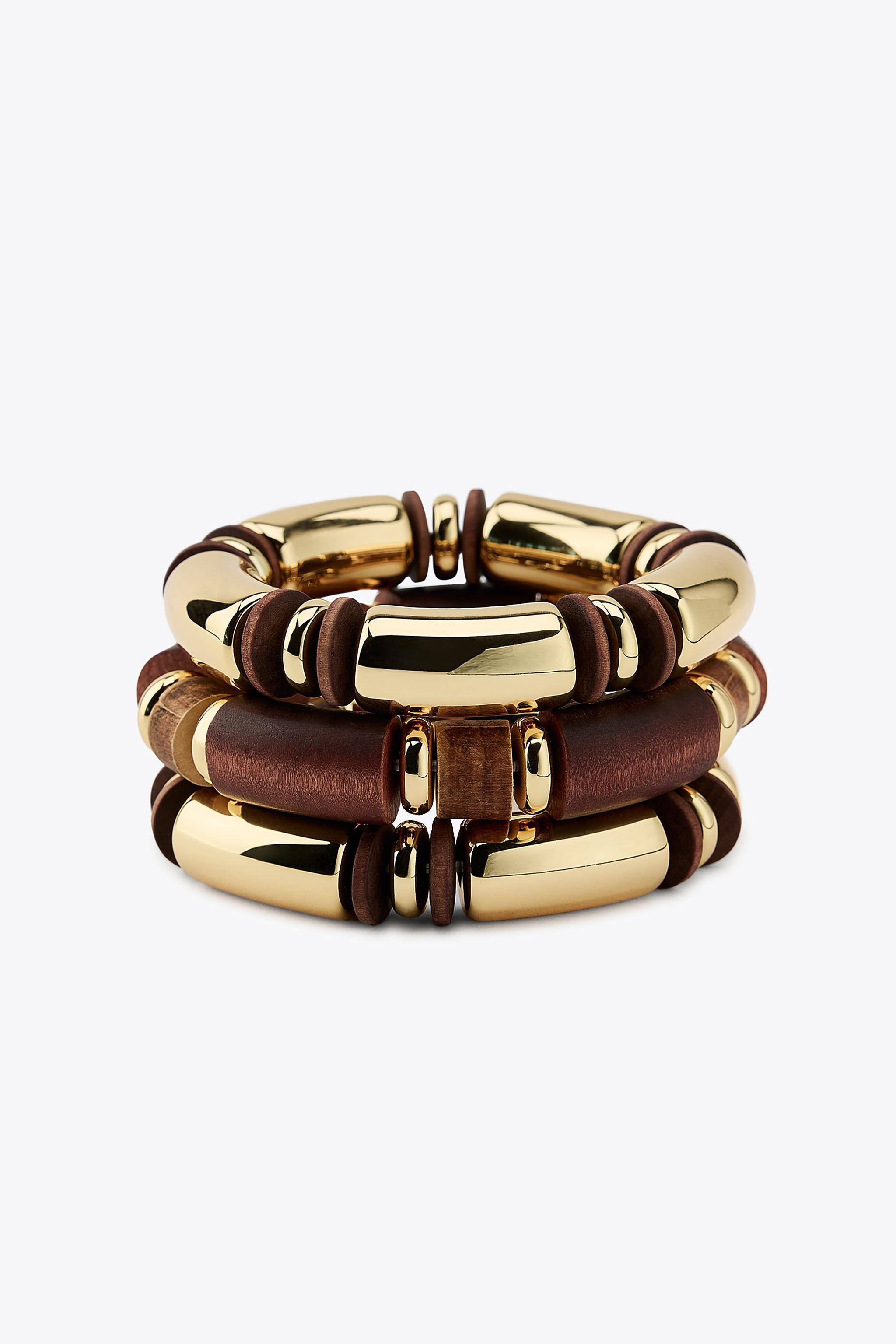 3-Pack of elasticated bracelets with wooden pieces and metal beads. | Zara US