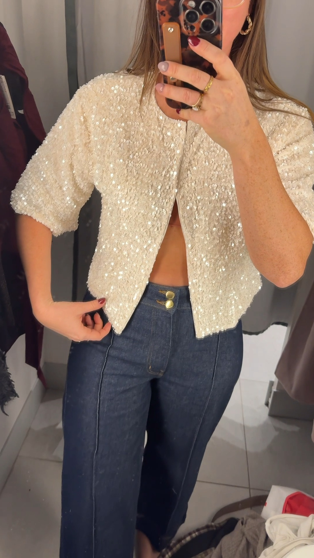 Cardigan also comes in black. Would be so cute over a sleepless dress.