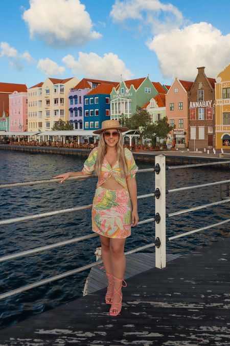 Super colorful dress perfect for a tropical vacation. Pink strappy heels and a sun hat.

#LTKtravel #LTKshoecrush #LTKstyletip