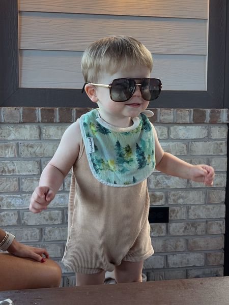 Toddler boy beige romper, drool bib & my Amazon sunglasses I just love! 🫶🏼

#LTKFamily #LTKKids #LTKBaby
