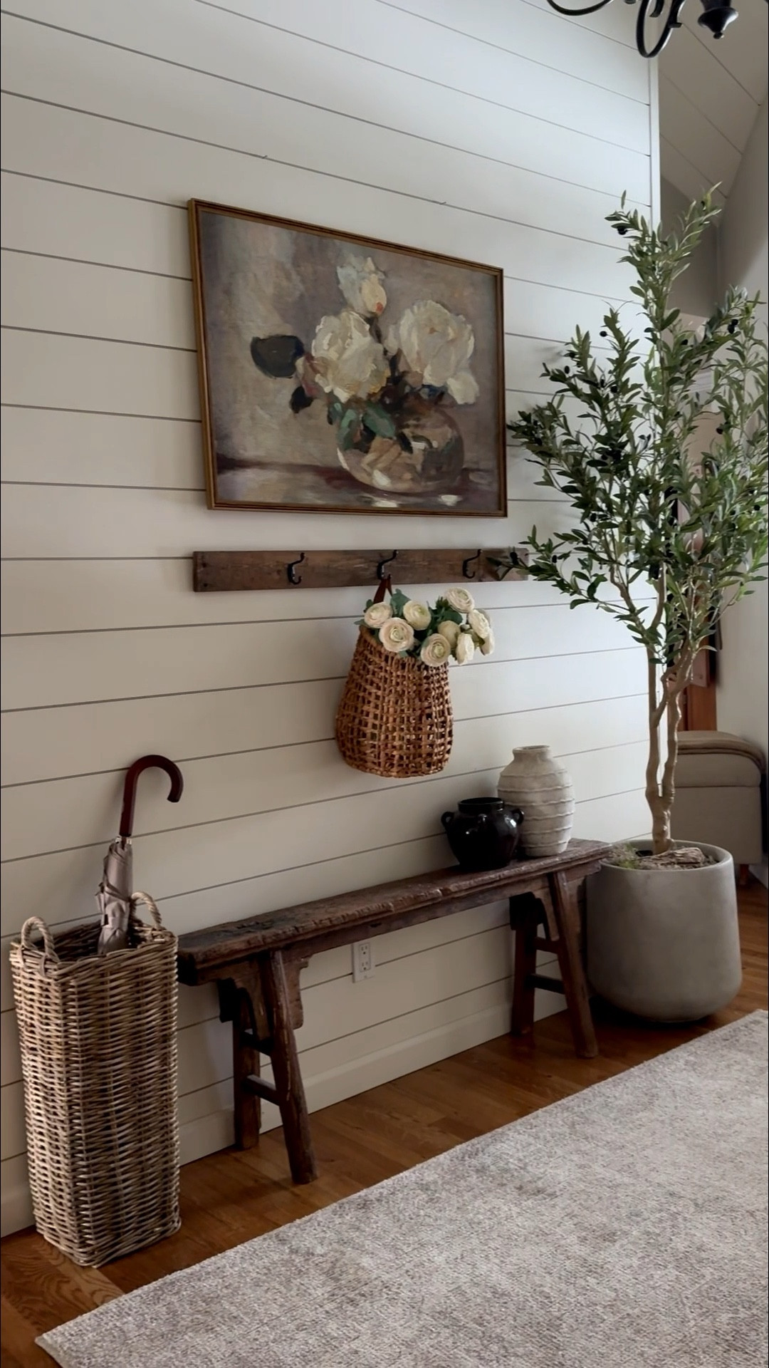 Want a collected, cozy winter entryway that feels effortless and refined? Start with one vintage piece of art as your focal point to draw the eye and add instant interest.
1️⃣ Add a story piece, like a vintage Tibetan farmers bench, to give personality and history.
2️⃣ Introduce height and life with a small olive tree or greenery.
3️⃣ Bring in European-inspired pottery to layer texture and make the space feel thoughtfully collected.
4️⃣ Add function with style — a basket for umbrellas gives a sense of living there.
5️⃣ Finish with a warm, hanging basket filled with realistic ranunculus to soften and elevate the look.
The key? Layer vintage, collected, and European-inspired pieces with everyday functional touches for a winter entryway that feels truly lived-in and refined 🤍


#LTKSeasonal #LTKstorytime #LTKHome