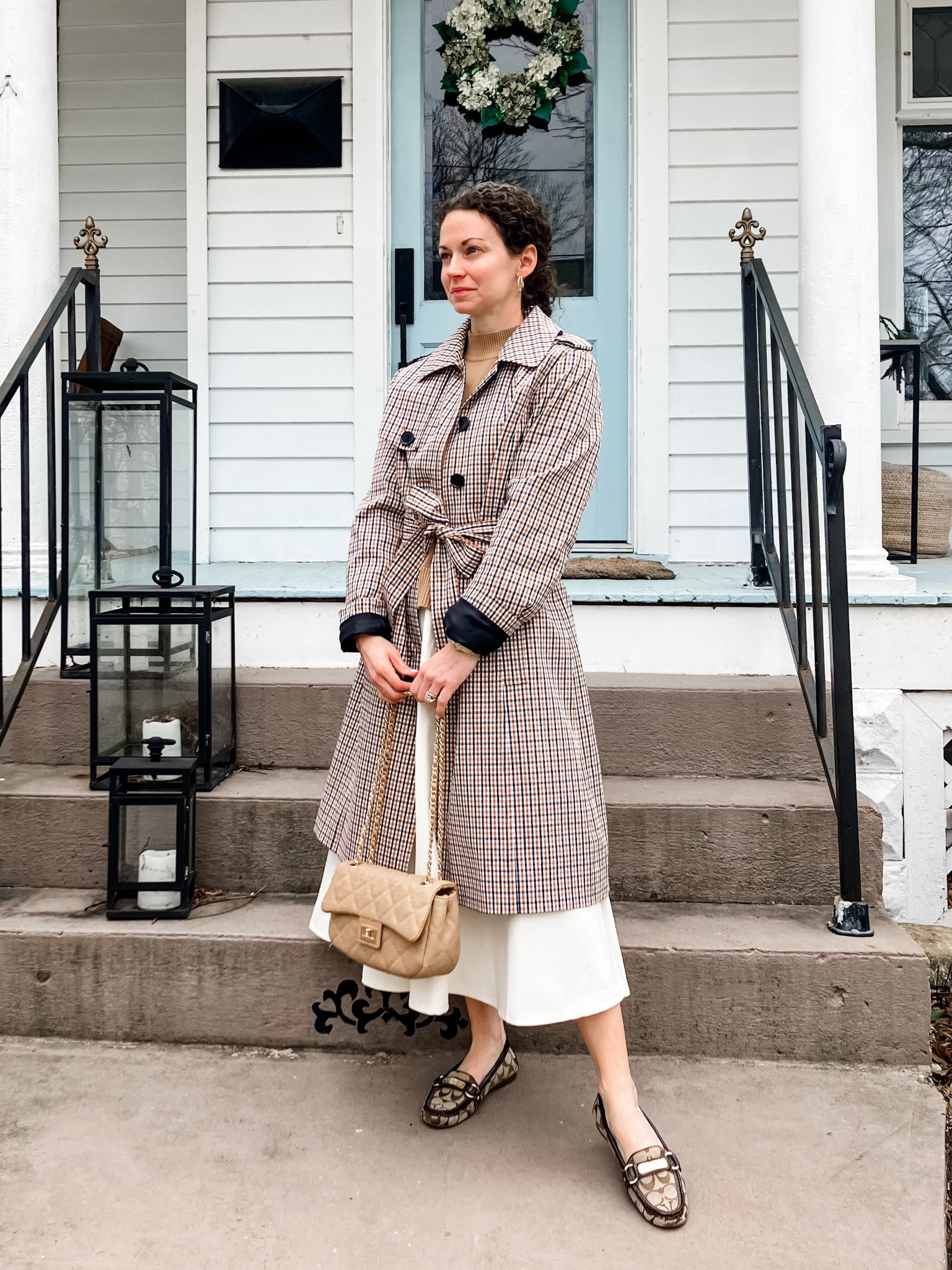 A classic neutral spring outfit!
Coat is old from Talbots, linking similar. 
Camel cotton sweater from Quince. 
White skirt from Chicwish. 
Gold braided hoops are old, linking similar. 
Neutral bag from Urban Expressions. 
Coach loafers are old, linking similar. 
Petite outfit. Church outfit. Modest outfit. Spring outfit.  Neutral outfit. 

#LTKootd #LTKdayinmylife #LTKmomlife