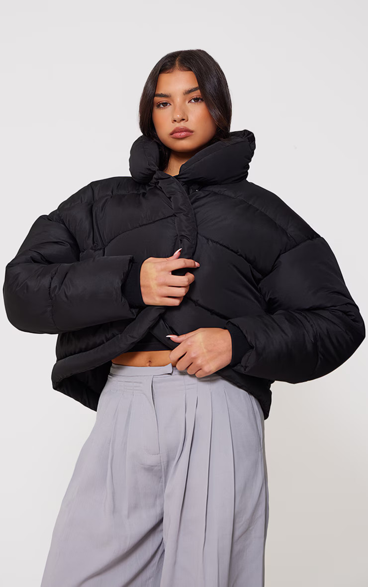 Black Quilted Asymmetric High Neck Puffer Jacket | PrettyLittleThing UK