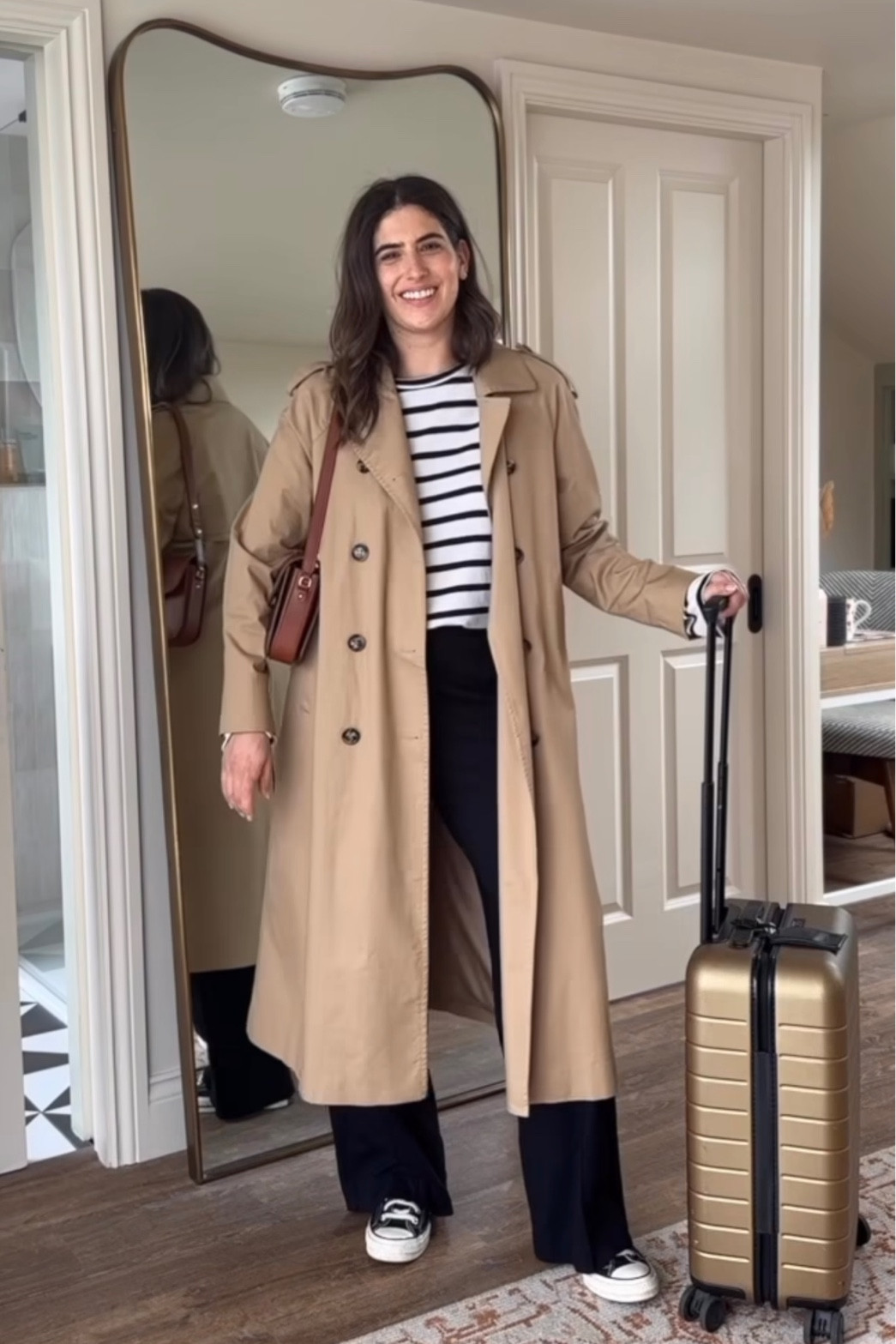 Travel outfit. Striped Breton top. Trench coat. Away carry on case 

#LTKSeasonal