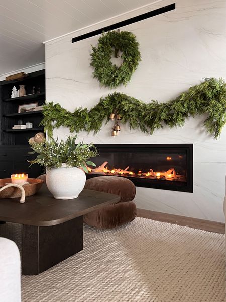 No mantle garland! We love how cozy of lower level fireplace feels with the garland draped across the front! 

#LTKhome #LTKSeasonal #LTKHoliday