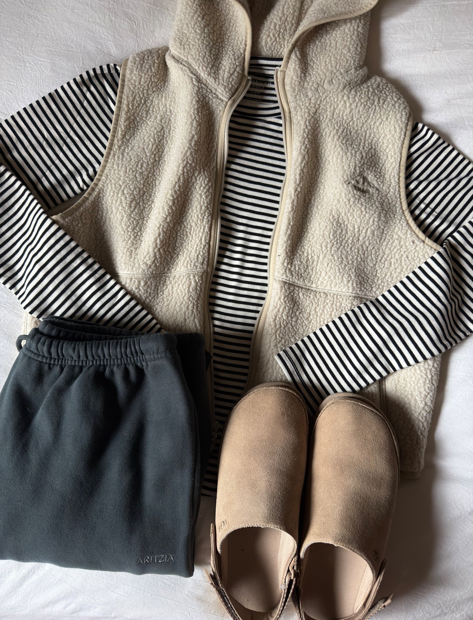 Vest + striped long sleeve + sweatpants

@aritzia #aritzia #aerie #comfyoutfit #cozyoutfit

#LTKFindsUnder100 #LTKHoliday #LTKGiftGuide