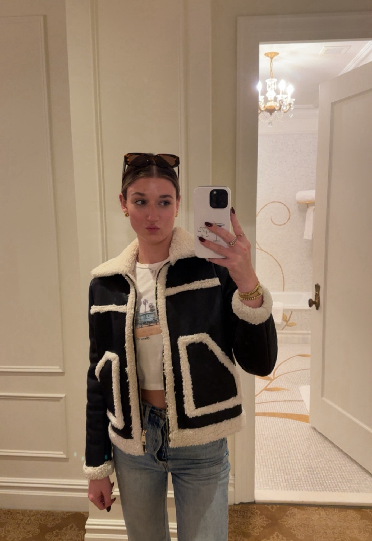 Black and fur winter jacket, light wash, straight leg jeans, princess Polly baby tee, black sunglasses, NYC winter outfits. Holiday outfit. City outfit. Sustainable fashion. Layering outfits. Vintage-inspired styles. Minimalist wardrobe. Boho chic. Street style trends. Capsule wardrobe ideas. Cold weather outfits. Statement accessories. Graphic tees. Oversized blazers. Monochromatic outfits. Colorful knitwear. Trendy loungewear. Denim jackets. Bold prints. Work-from-home outfits. Accessories styling. Seasonal outfits.

#LTKStyleTip #LTKTravel #LTKFindsUnder100