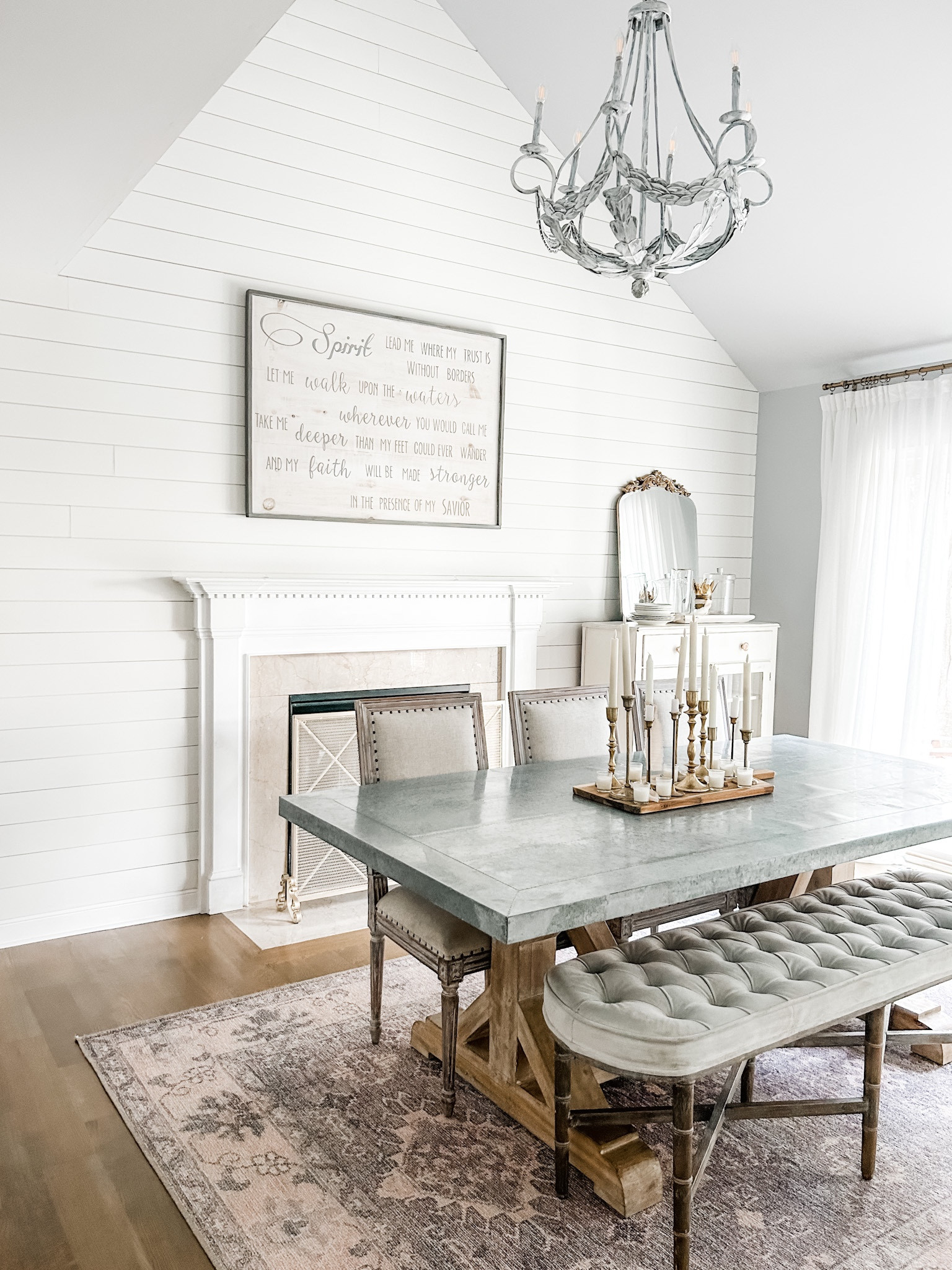 Dining room decor, zinc top dining table, farmhouse chandelier, gold fire screen, fireplace screen, taper candles, flameless taper candles, gold candle holders, Amazon curtains, semi sheer curtain panels, pinch pleat drapes, gold curtain rod, curtain clip rings, wooden serving board, dining room table, tufted bench, dining bench seat. 

#LTKFind #LTKstyletip #LTKhome