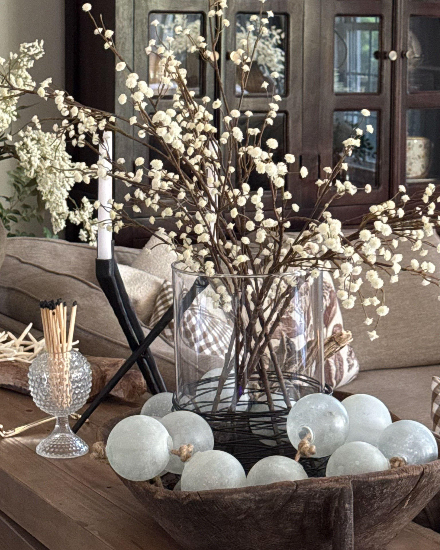 Friday Photos of my Home Lately!!
My moody floral print is from @simplyinspireddesignco 
and my code is: FARMHOUSECHIC15

Picture frames, vases, baby’s breath stems, console table, lavender, vintage wood carved tray, cherry blossoms, Black Olive Tree, desk, office chair, Mopio cabinets and bookcases, horse print, starfish, glass cylinder, black cabinet, 3 legged stool, vintage mortar, faux garlic, brass salt & pepper grinders, sea glass garland, black candelabra, round coffee table, woven storage boxes, floral green crock, green glass olive oil dispenser, candle warmer

#LTKHome #LTKSeasonal #LTKstorytime