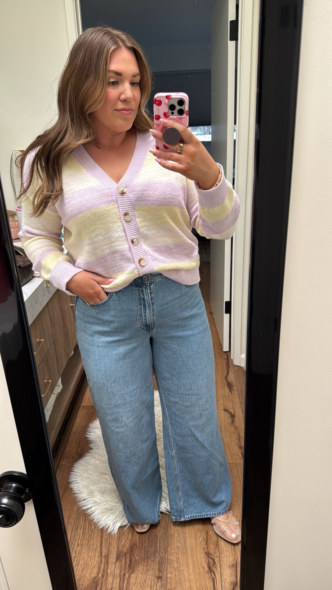 curvy midsize spring vacation outfit! wearing size xl in yellow and lilac striped sweater and size 31 in wide leg denim 

#LTKMidsize #LTKFindsUnder100 #LTKSeasonal
