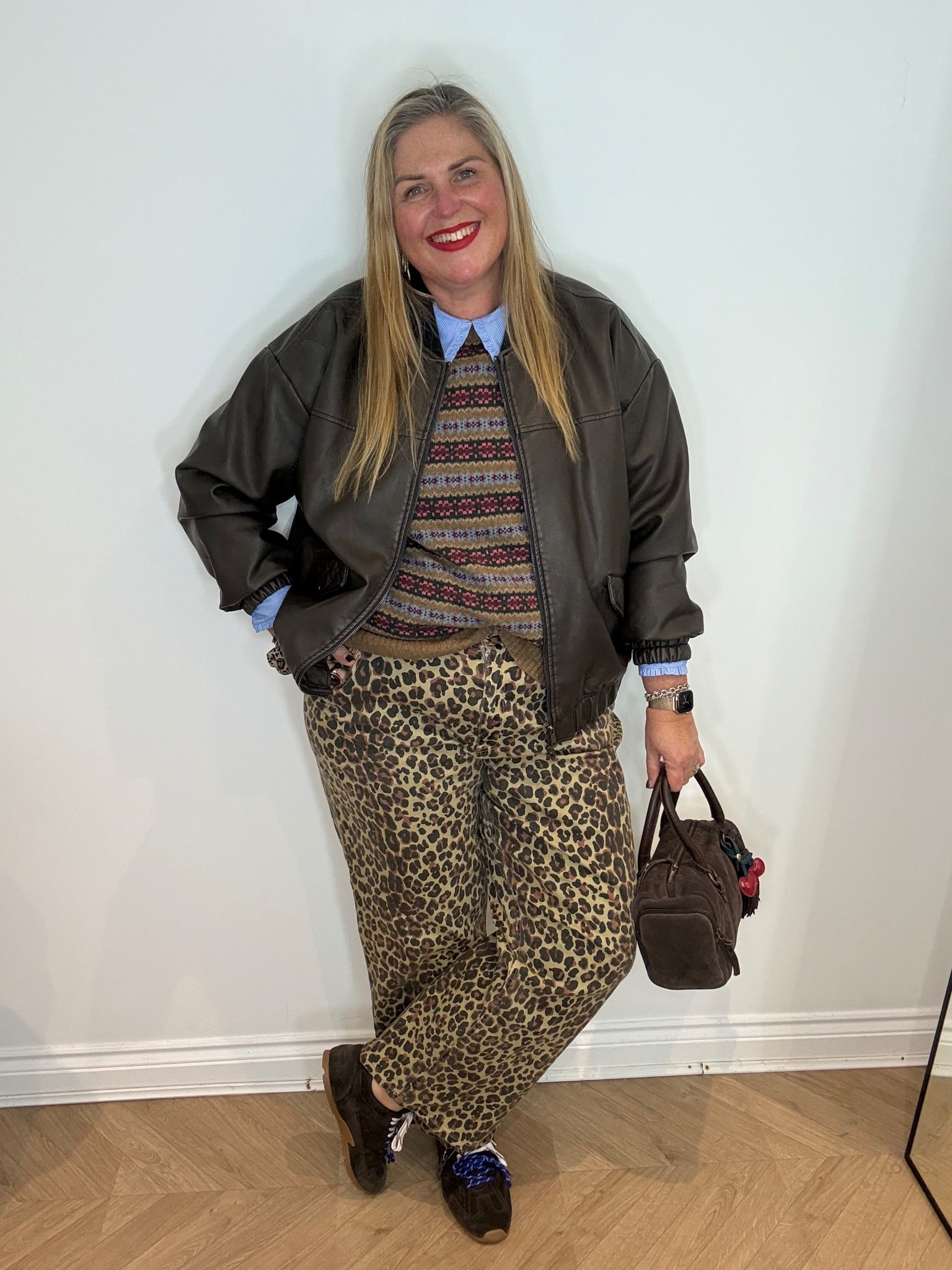Leopard jeans, suede trainers, faux leather bomber jacket, argyle jumper, blue striped shirt, suede bag 

#LTKplussize #LTKjeans #LTKwinter