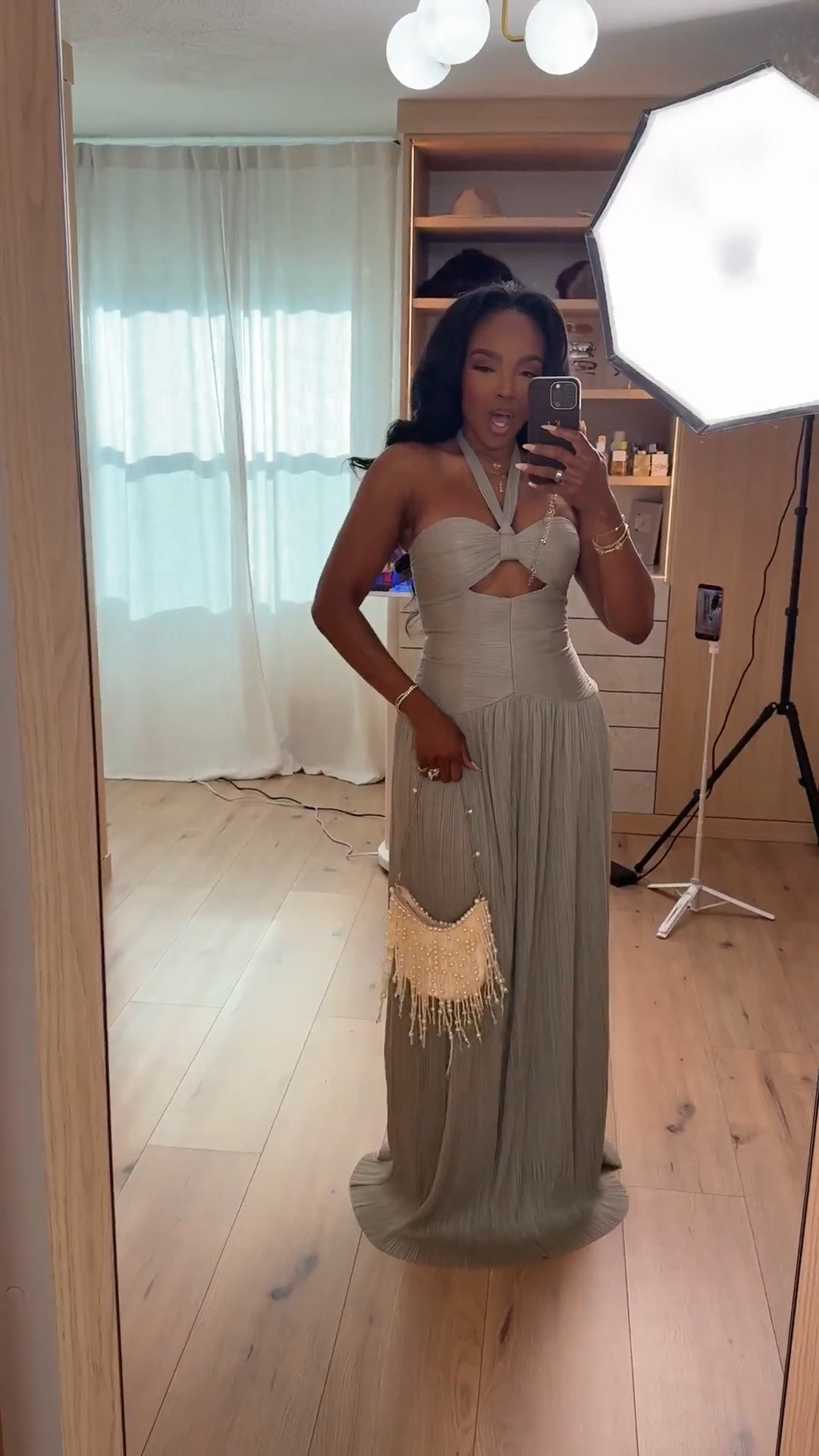 Hi Babes!

Okay this dress is giving luxury vacation energy. The soft sage color, pleated skirt, and structured bodice make it look so much more expensive than it is. The halter neckline and subtle cutout detail create the perfect balance of elegant and feminine.

The flowy pleated skirt moves beautifully when you walk, and I love how the neutral tone pairs effortlessly with pearl, gold, and raffia accessories. This is one of those dresses that makes you feel instantly put together the second you put it on. Trust.

Where to wear this:
• Destination weddings
• Resort dinners
• Cruise nights
• Summer special events
• Anniversary dinners

Undergarments: Sticky bra and nude seamless underwear recommended for the smoothest fit (linked).

Everything is linked below!

xx Kira | IG: KirasFashionFinds

34D - 27 - 40 • Size Small or 4