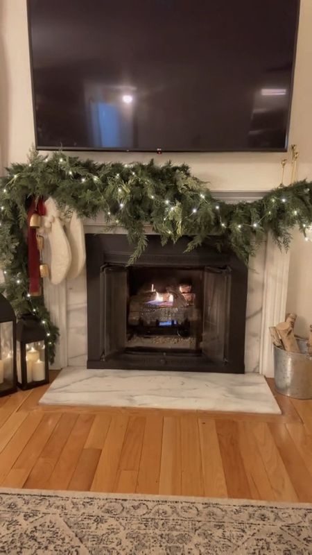 The christms decor is coming together more slowly than normal this year. Trying to take my time snd enjoy and the process of the holiday season! Here is a peek at how i styled my christmas decor on mantle. Faux garland, Christmas stockings, faux candles, fairy lights, burgundy ribbon

Holiday decor, christmas decor, christmas mantle 

#homewithem #christmasdecor #holidaydecor #christmasmantledecor #christmasfireplace #christmasgarland #garland #christmasfireplacegarland #cozychristmas #hollyjollychristmas 

#LTKhome #LTKHoliday #LTKSeasonal