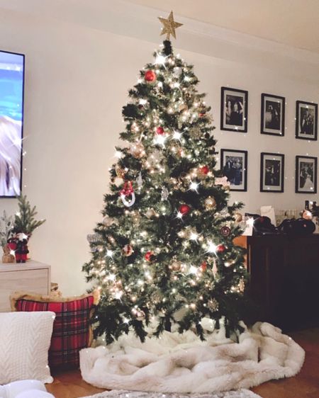 It’s beginning to look a lot like Christmas 🤶🏼 obsessed with this fake tree because it looks SO REAL. We’ve been using for about 5 years. Paired with a faux fur rug as the tree skirt, plaid throw pillows an flame less candles (perfect around kids). Linked our gallery wall picture frames too. #holidaysale #christmastree #christmasdecor

#LTKhome #LTKsalealert #LTKHoliday