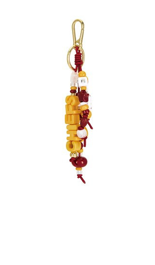 BaubleBar Kansas City Chiefs Bag Charm in Red,Yellow. | Revolve Clothing (Global)