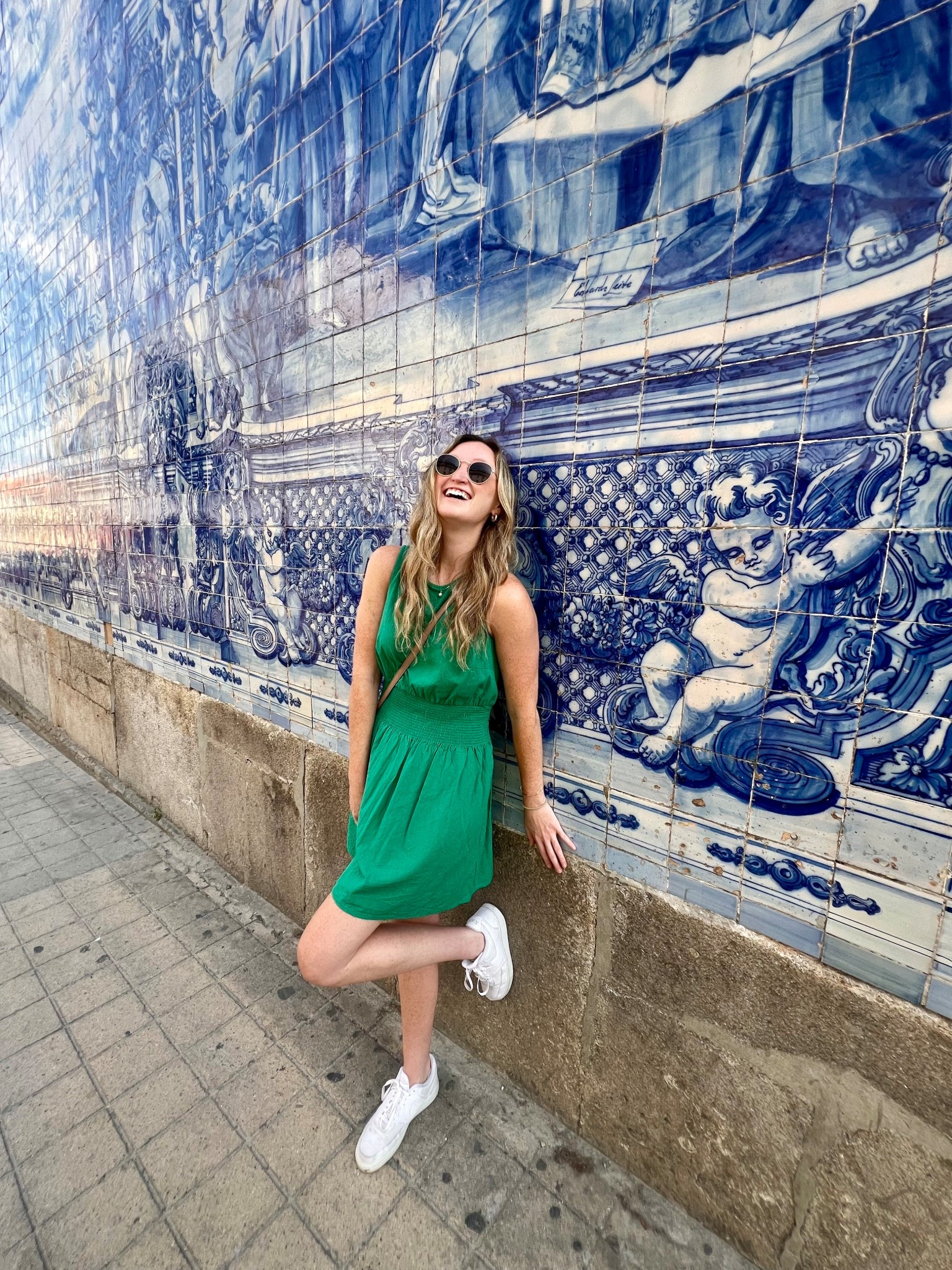 Casual Europe vacation outfit. Summer travel outfit. Tall girl friendly dress. Teal affordable sun dress, nude quilted bag, comfortable travel white sneakers. 

#LTKTravel #LTKSeasonal #LTKFindsUnder50
