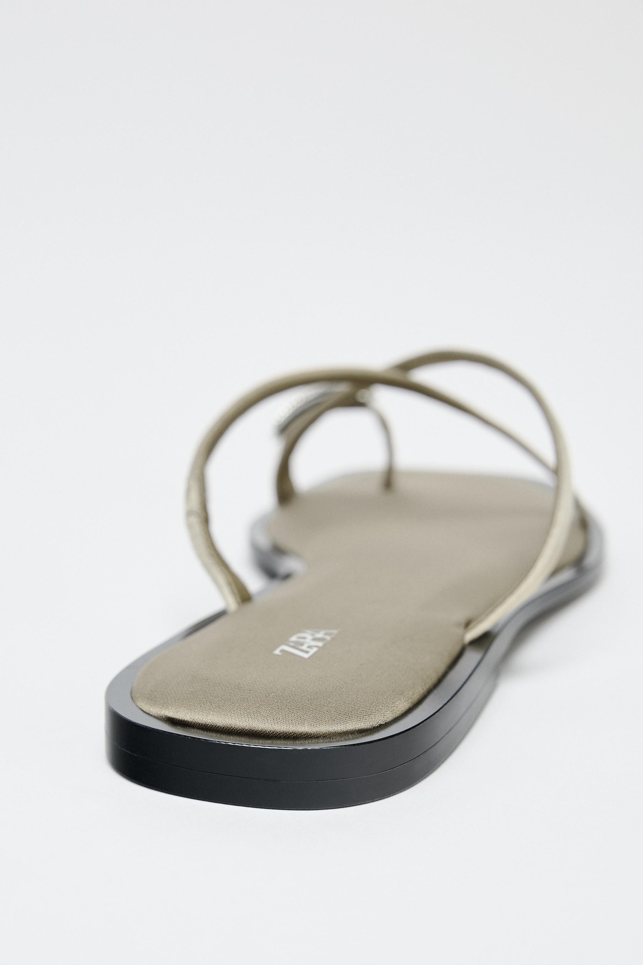 Flat sandals. Strappy upper with toe loop and metallic embellishment. Square toe. Sole height: 0.... | Zara US