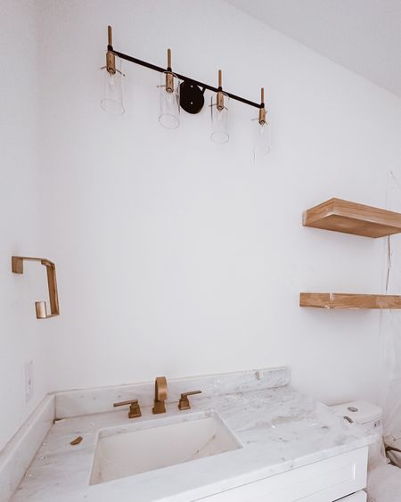 Modern bathroom vanity lights and champagne bronze hardware 

#LTKhome #LTKFind