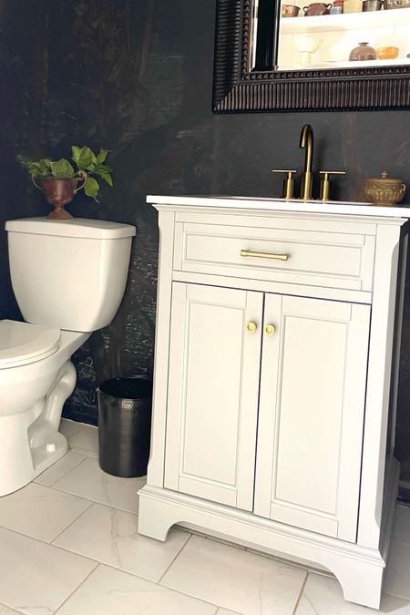 Our half bath makeover started when I stumbled on this classic bathroom vanity. Then I found this modern gold faucet fixture that was a great match.

#LTKfindsunder100 #LTKstyletip #LTKhome