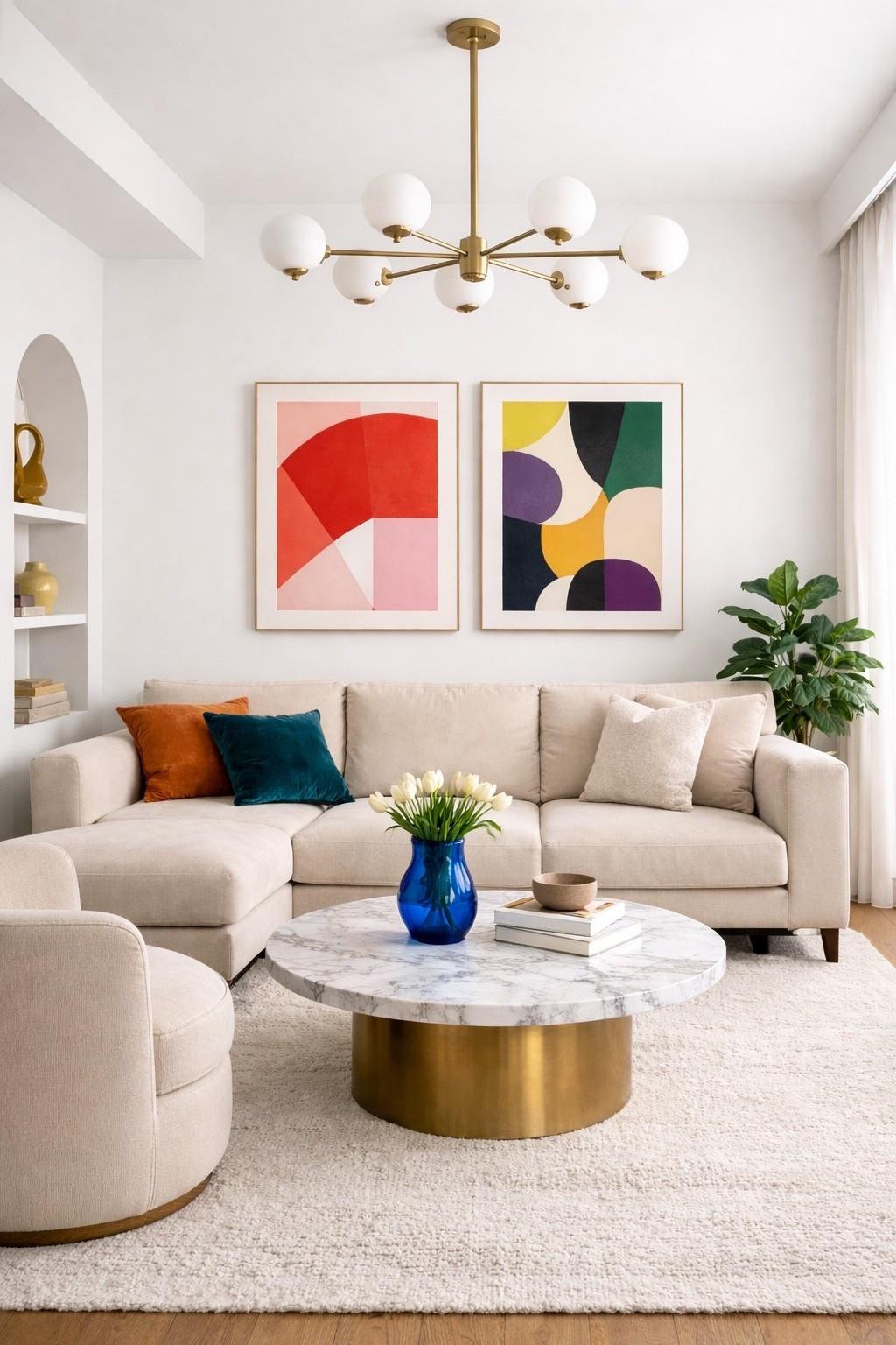Bright modern living room with a soft curved beige sofa, marble coffee table with a gold base, colorful abstract wall art and elegant modern chandelier. A beautiful neutral interior with warm textures and minimal Scandinavian design that creates a cozy and sophisticated atmosphere.

#livingroom
#modernlivingroom
#neutralhome
#scandinaviandesign
#modernhome
#interiordesign
#homedecor
#luxurylivingroom
#pinteresthome
#cozyhome
#beigelivingroom
#moderninterior
#ltkhome
#homestyle
#minimalhome
