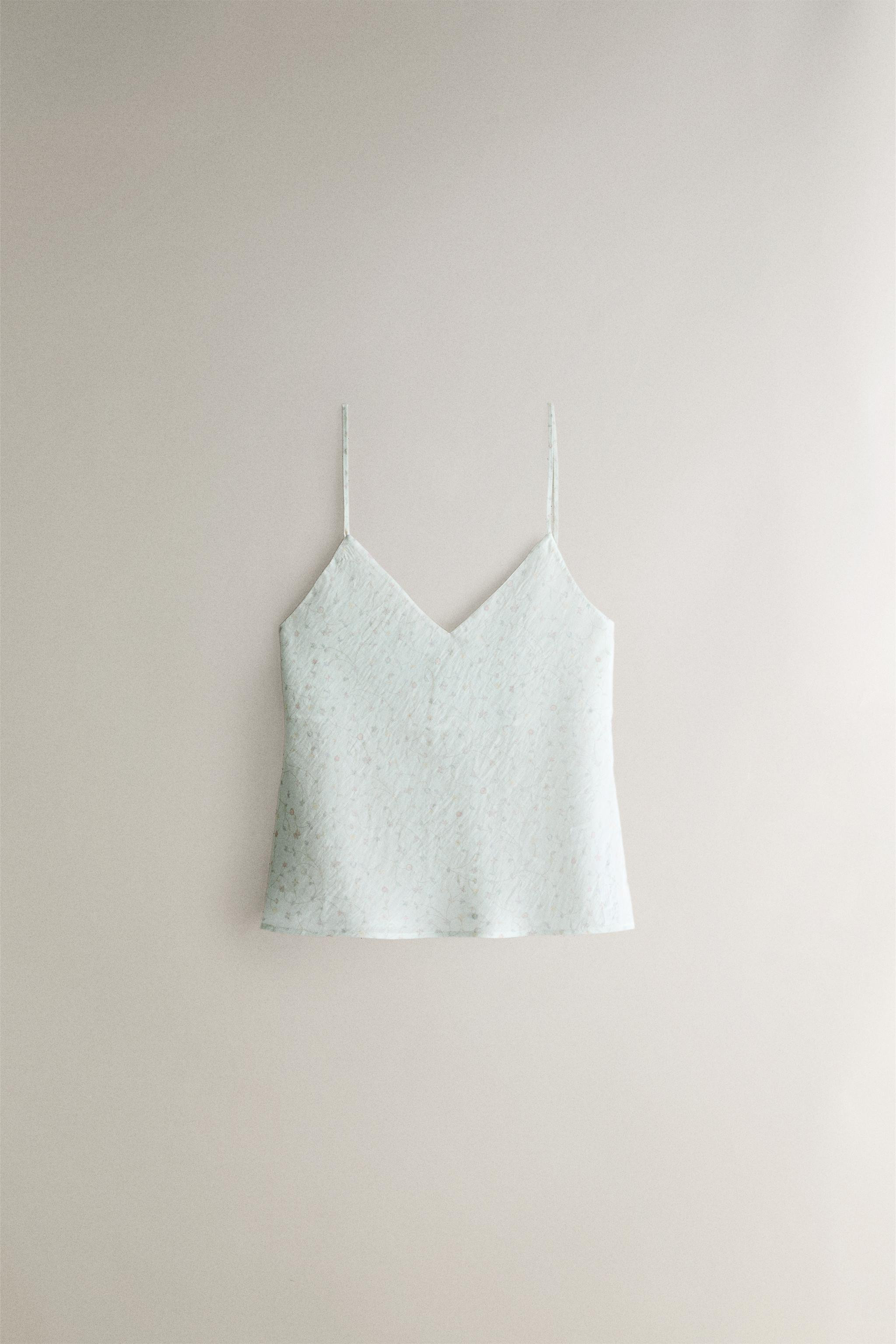 Sheer fabric top with a small, colorful floral and branch print, featuring a V-neck and thin stra... | Zara US
