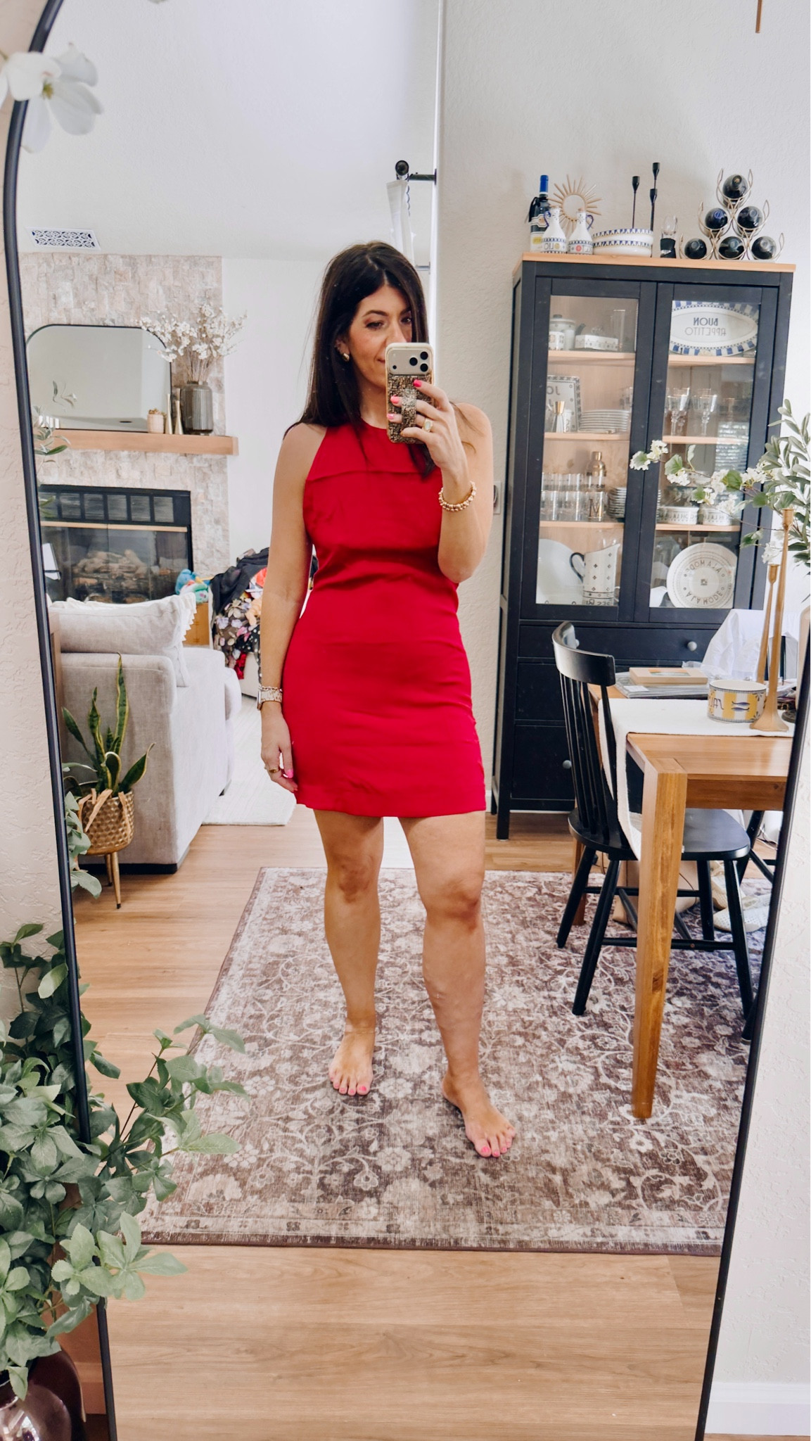 In a large halter mini dress

#LTKTall #LTKMidsize #LTKOver40