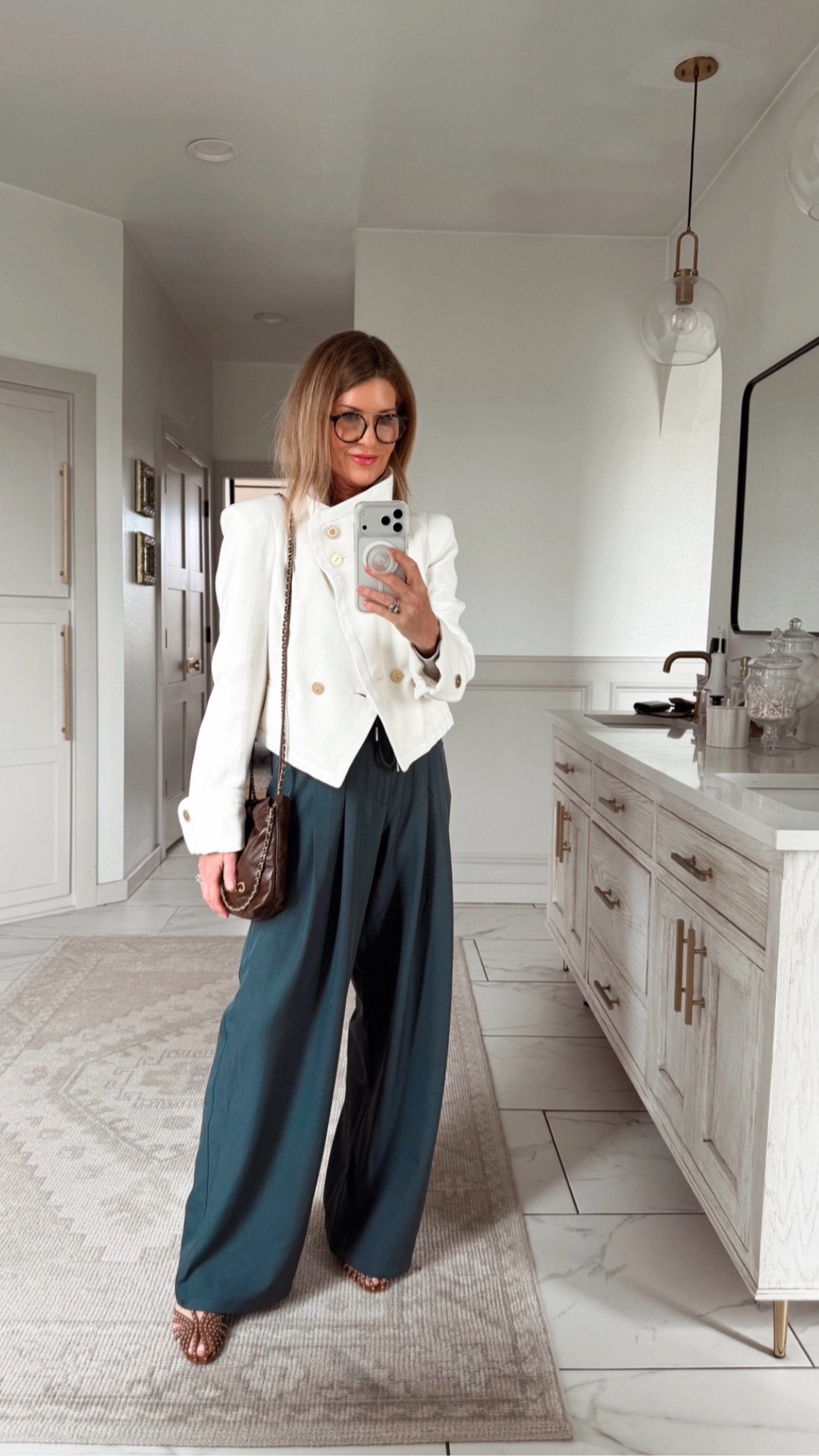Wearing a small jacket and small pants 