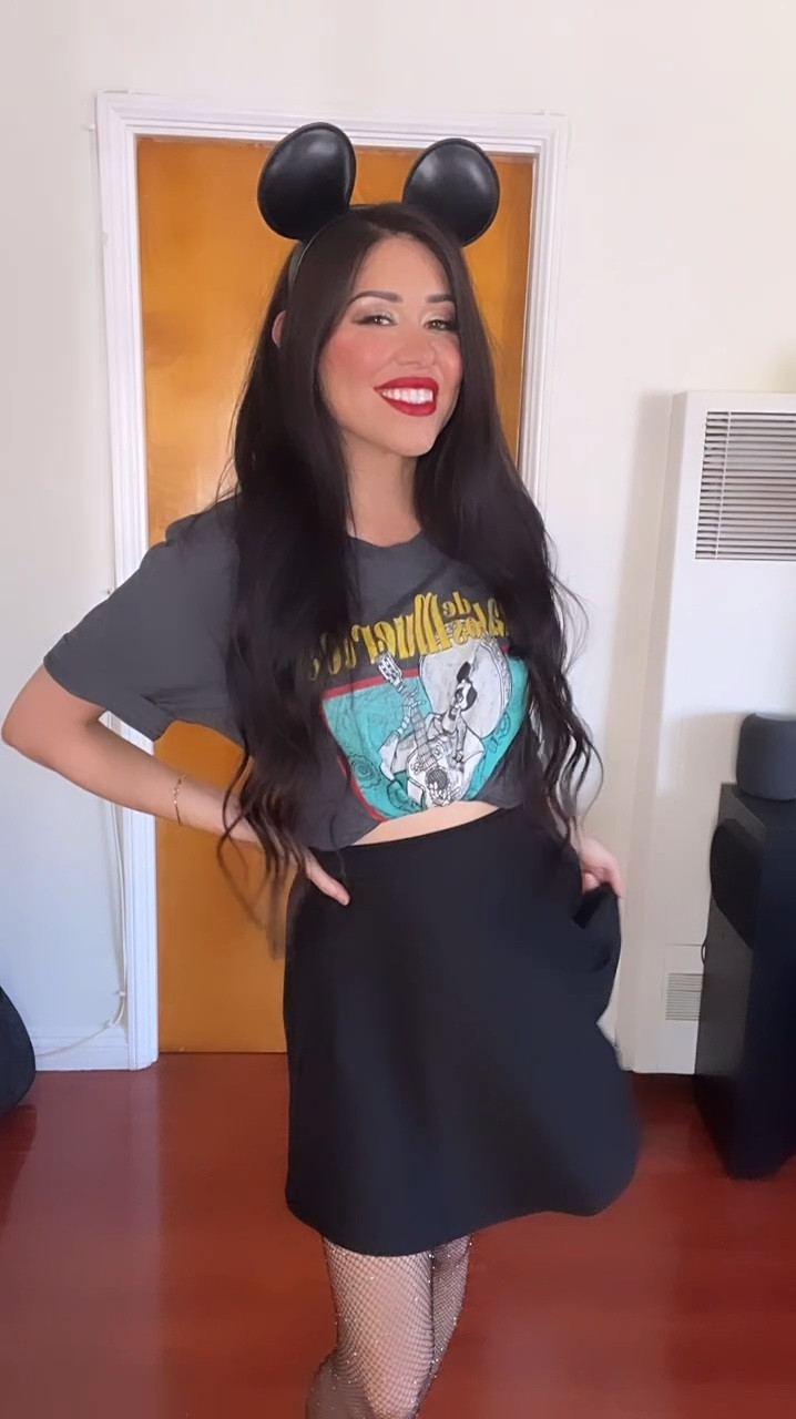 Outfit for Oogie Boogie in the summer heat! Layered this Coco Ernesto De La Cruz T-shirt, with a black lace skater skirt, paired with black sparkle fishnet tights! The Mickey Ears are from Disneyland Parks!  🖤🖤🖤 #DisneyOutfit #DisneyOutfitInspo #DisneyHalloweenOutfit 

#LTKSeasonal #LTKStyleTip #LTKParties