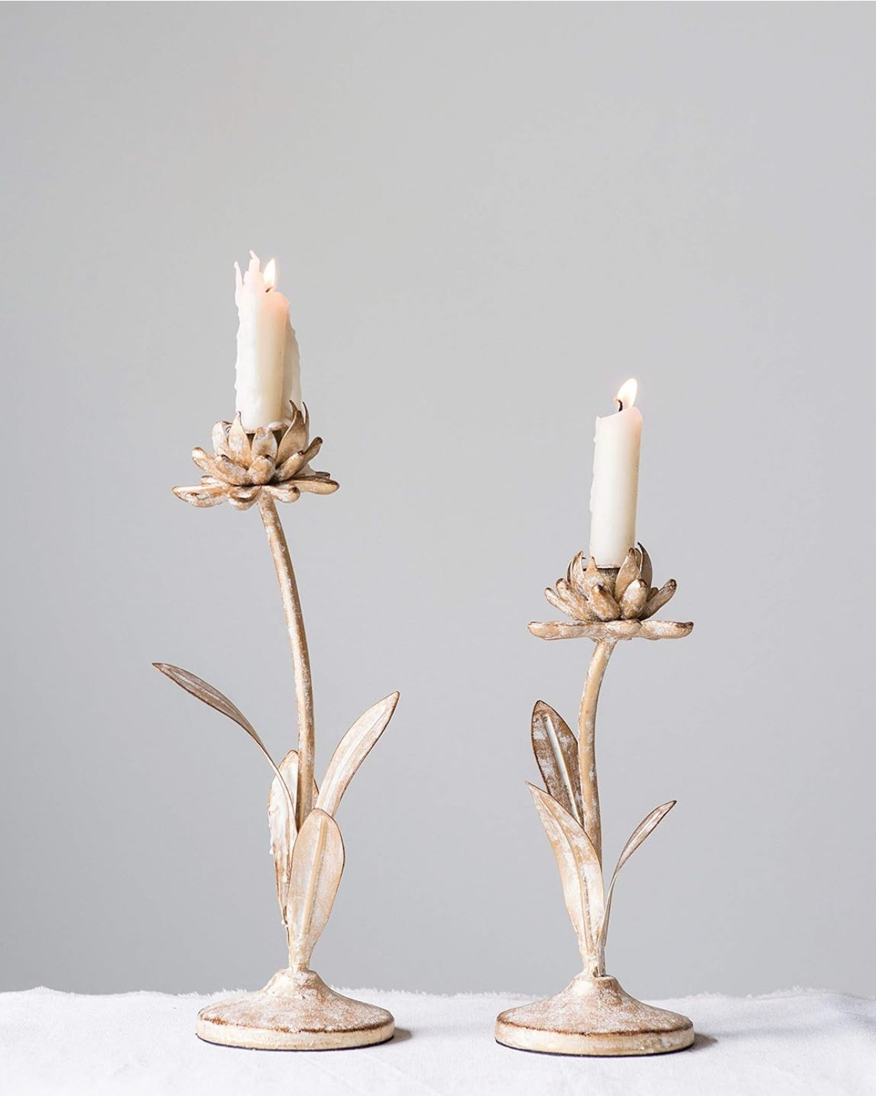 Cut Metal Flower Shaped Taper Candle Holder in Distressed Gold Finish
Set of 2 
*Currently on sale*

Used these for a bridal shower yesterday… They are beautiful! Could use them for Easter, Mother’s Day, weddings, and set them out for spring and summer! 
 