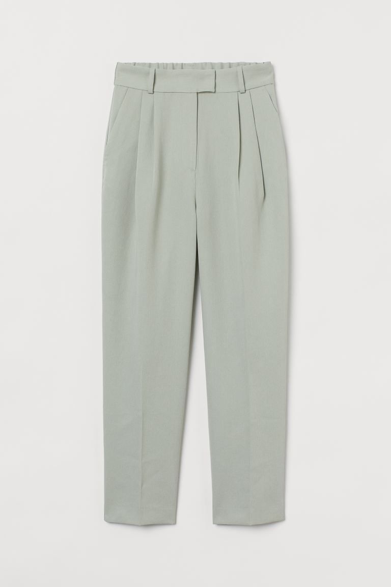Ankle-length trousers in woven fabric. High waist with covered elastication at the back, a zip fl... | H&M (UK, MY, IN, SG, PH, TW, HK)