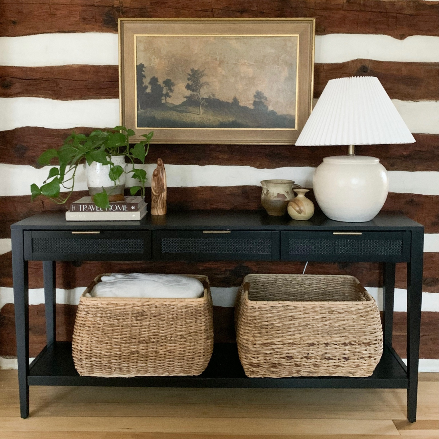 Cabin console table. We just finished up this pretty area in my parent’s cabin and I just love how it turned out. So cozy with this styled console table, baskets and pleated lamp all from Target. We just added a vintage print to top it off and I’m in love. The lamp and the Studio McGee console table has been out of stock forever and they are finally back! 

#LTKhome #LTKunder100 #LTKFind