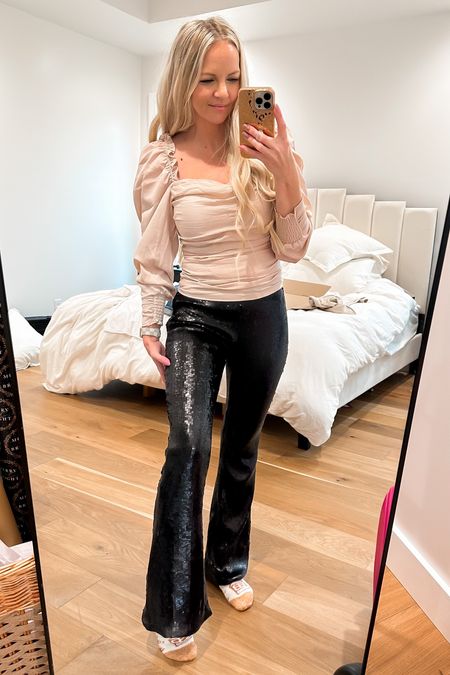 Please excuse my fluffy socks and messy room. Wanted to show this outfit before these sequin flare pants sell out! 
They are very comfortable, not a ton of stretch but definitely true to size. 
I won’t be able to wear very tall heels with them and I’m 5’7” for reference! 

Holiday outfit Christmas party outfit

#LTKHoliday #LTKfit #LTKstyletip