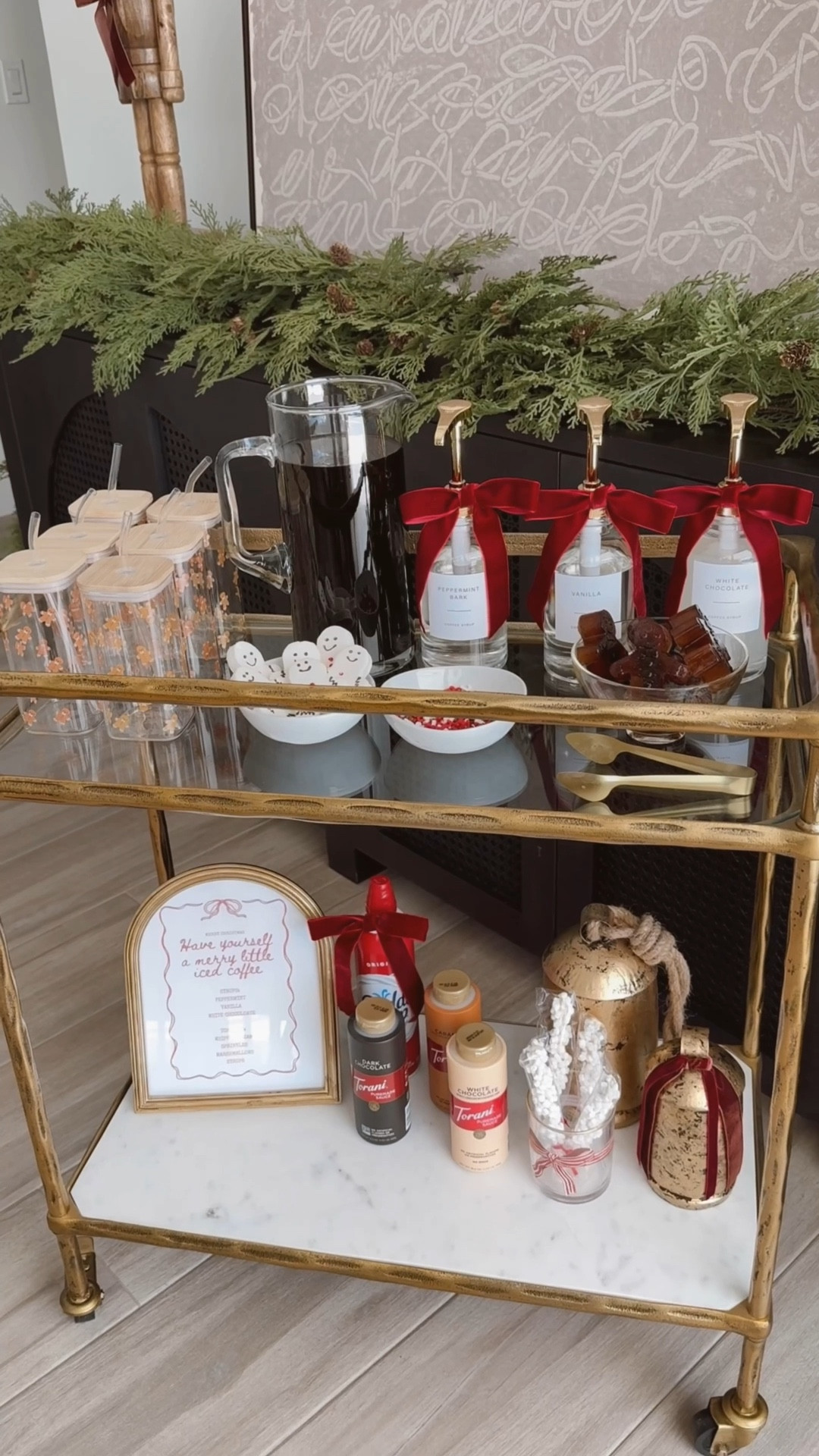 Make Christmas morning extra magical with an iced coffee bar your guests will love! ☕✨ 
Create the ultimate setup—think festive syrups, gingerbread coffee ice cubes, and all the toppings 🤍

(PS: I was so busy making it cute, I forgot the creamer! Guess Santa’s bringing me some… 😂)


#coffeebar #amazonhome #amazonfinds #bow #christmasdecor #christmastime #neutralchristmas #christmaspartyideas #holidayhostess #Itkhome #Itkholiday #ltkunder25 #christmascoffeebar #christmasinspiration #icedcoffee #christmasmorning #christmas #coffeebarcart

#LTKWatchNow #LTKHoliday #LTKHome