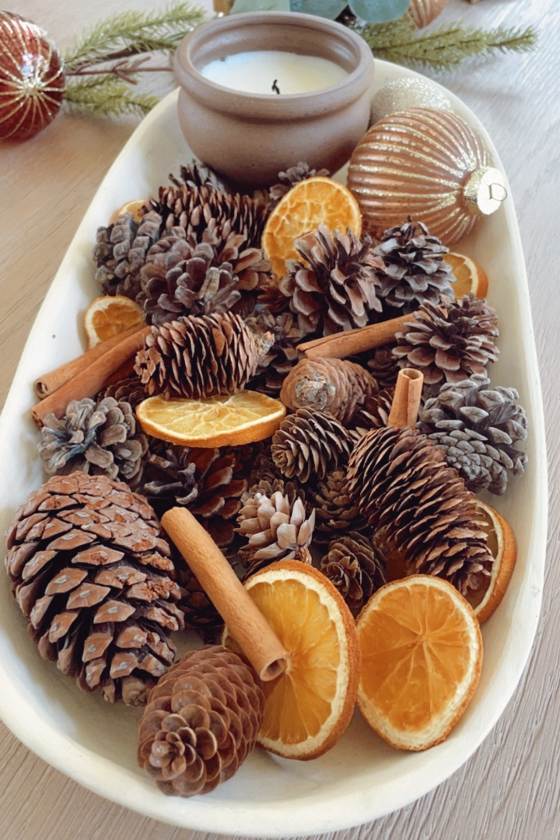 Easy holiday centerpiece for a dining table, coffee table or console table. 



#LTKHome #LTKHoliday #LTKSeasonal